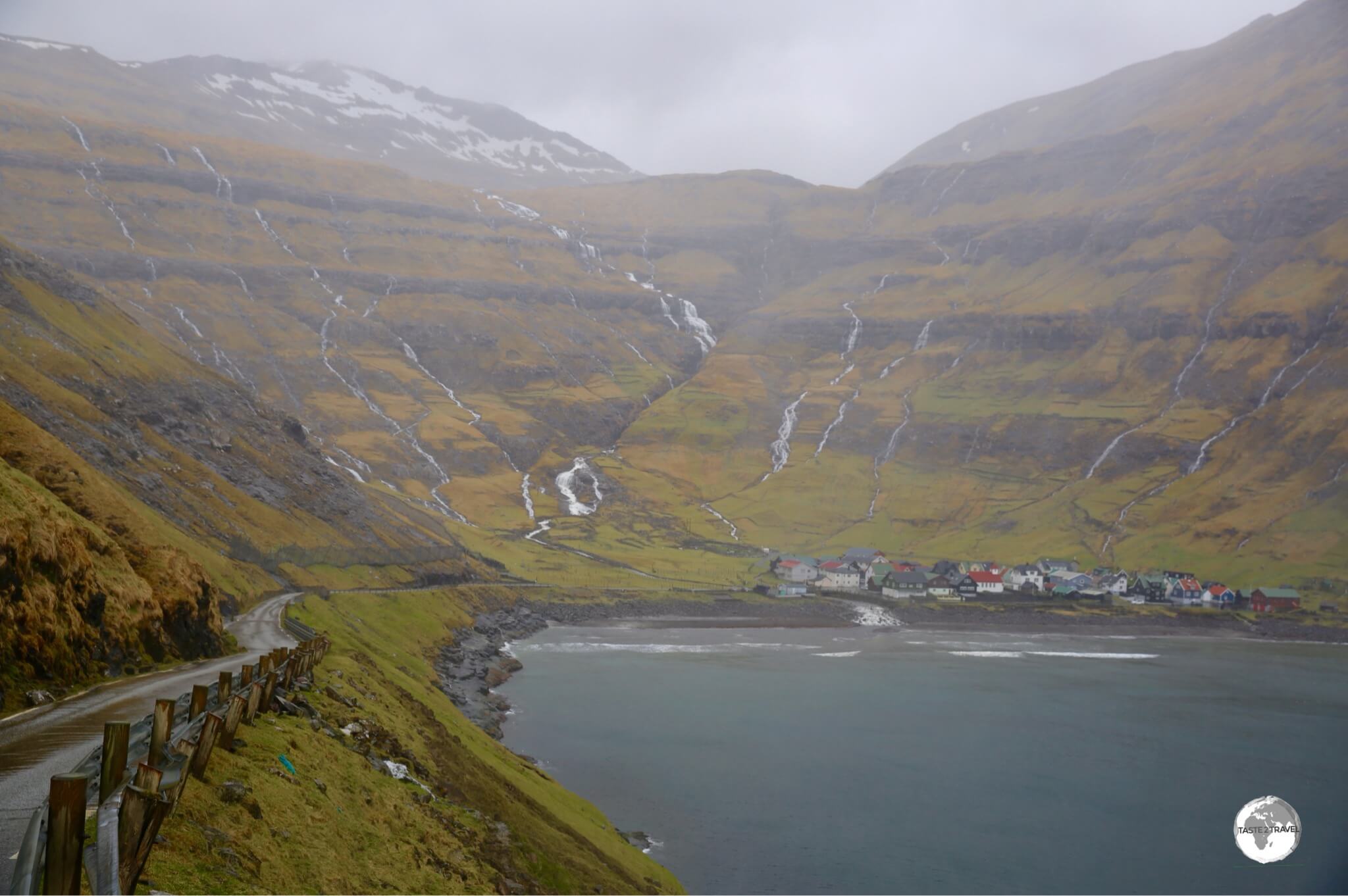 A view of the very narrow route 594 as it makes its final descent into the coastal village of Tjørnuvík.