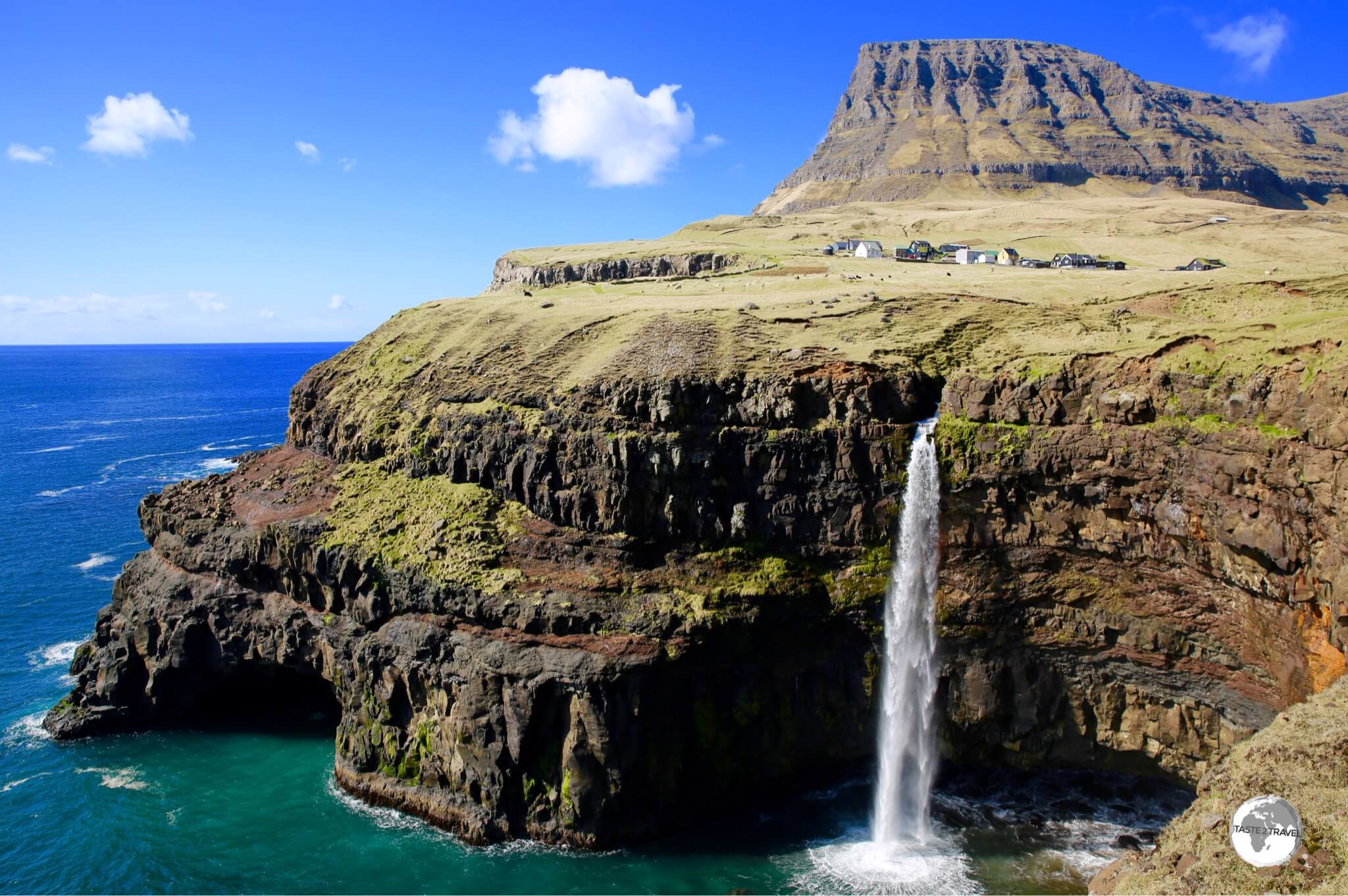 The breathtakingly beautiful Mulafossur Waterfall plunges 60 metres into the Atlantic Ocean near the village of Gásadalur.