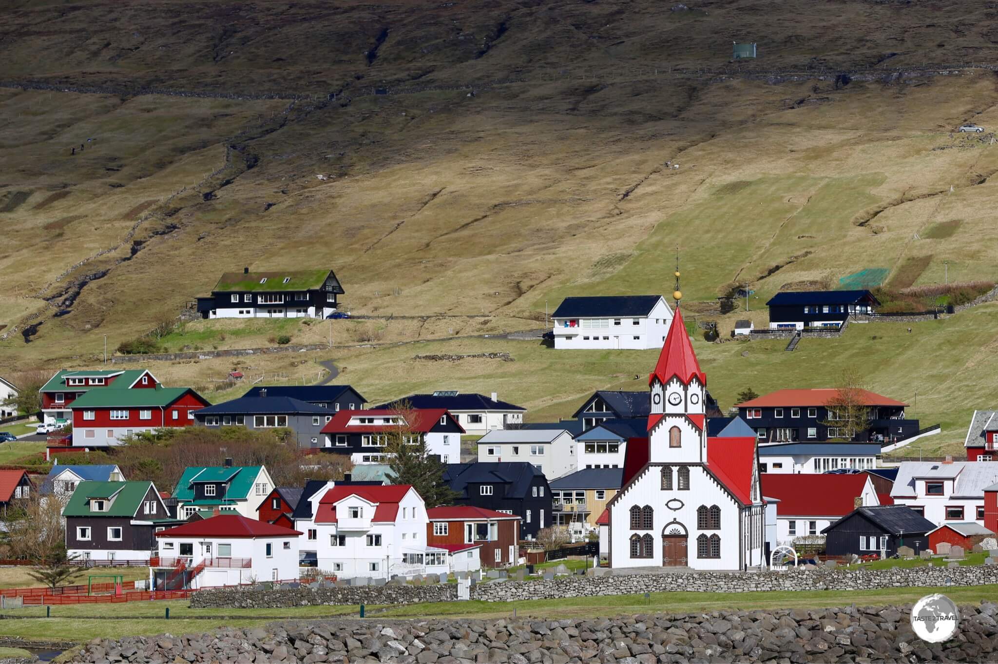 The striking church of Sandavá dominates the village of Sandavágur, which has twice been voted the best-kept village in the Faroe Islands.