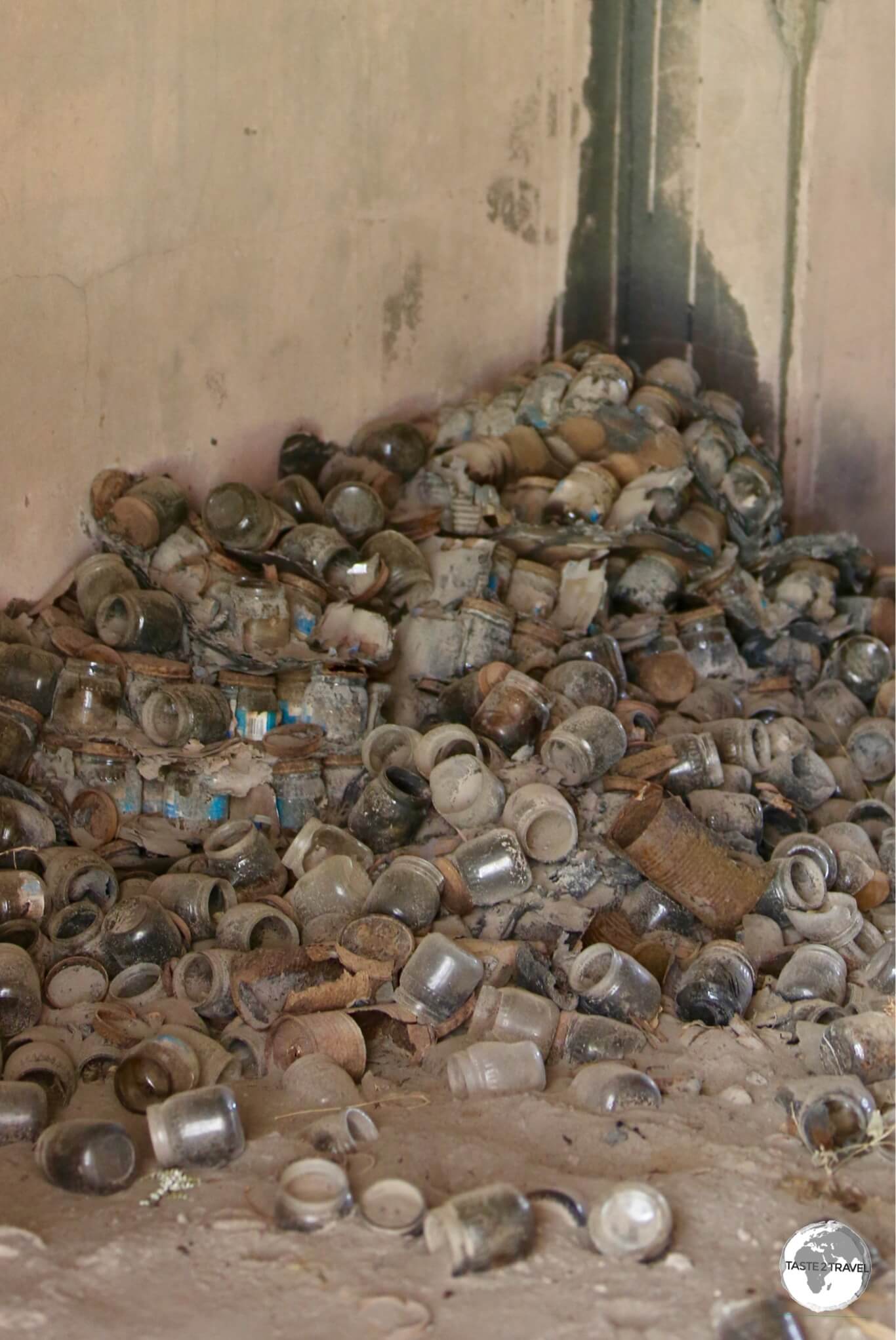 Empty baby food bottles litter the ash-covered floor of Angelo's supermarket.