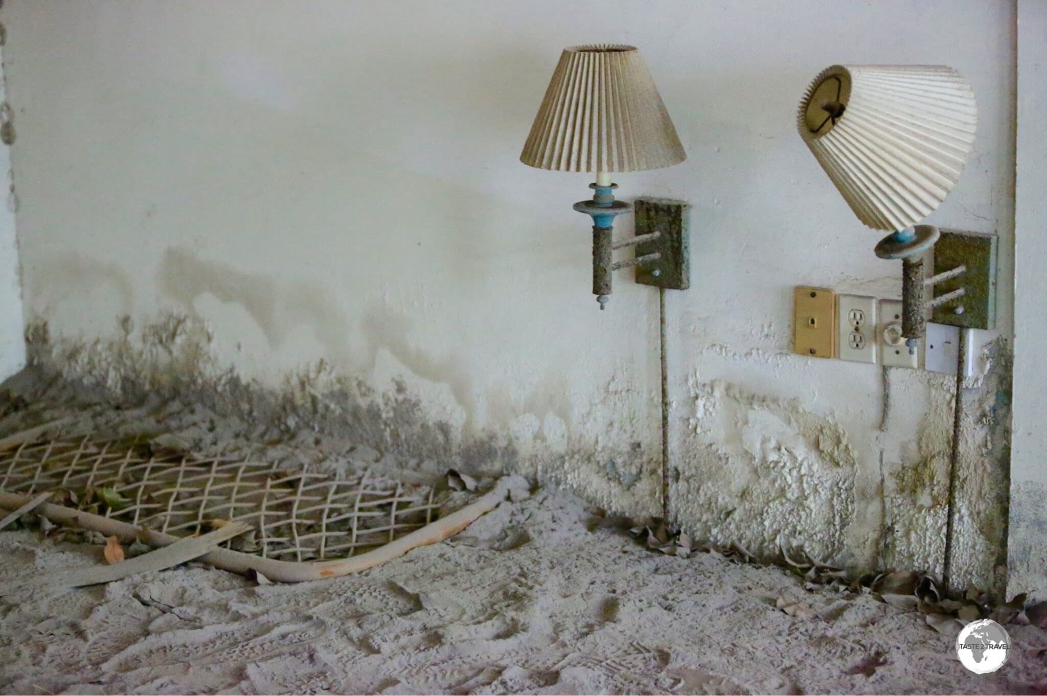 An old bedhead and bedside lights, which are now just above the new ground level at the Montserrat Springs hotel. 