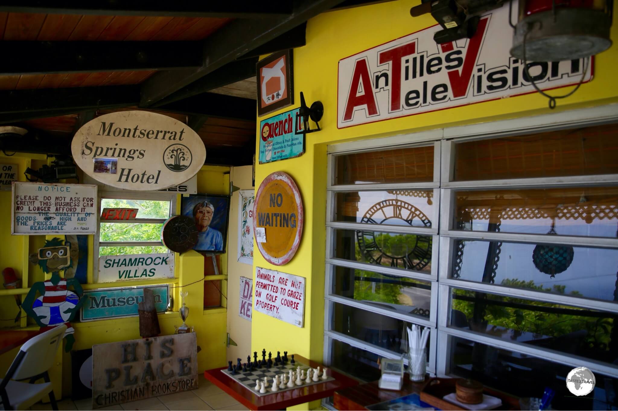 Signs salvaged from Plymouth businesses are displayed at the Hilltop Coffee House.