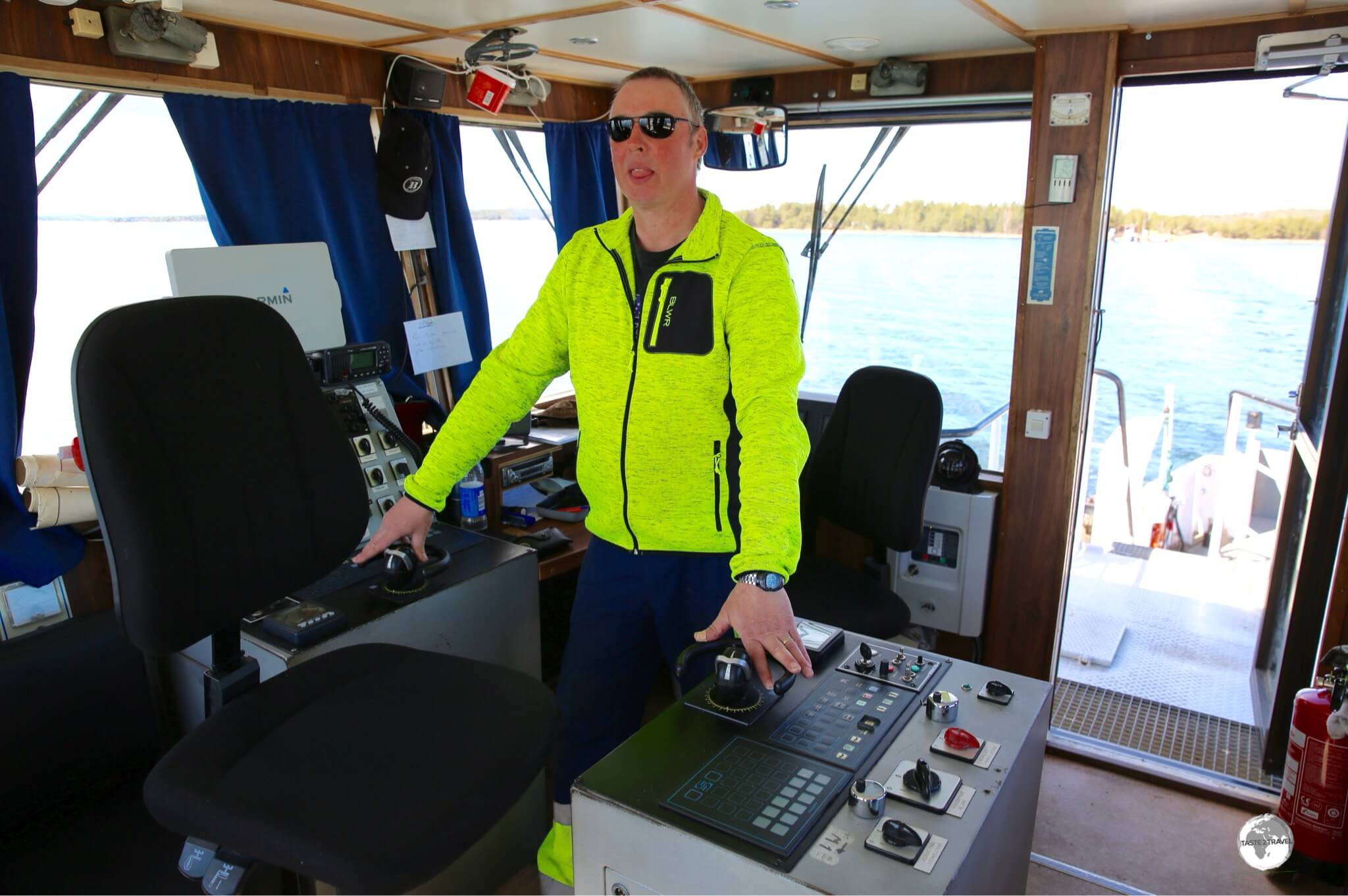 The Captain on the bridge of a Cable ferry on Vårdö Island.