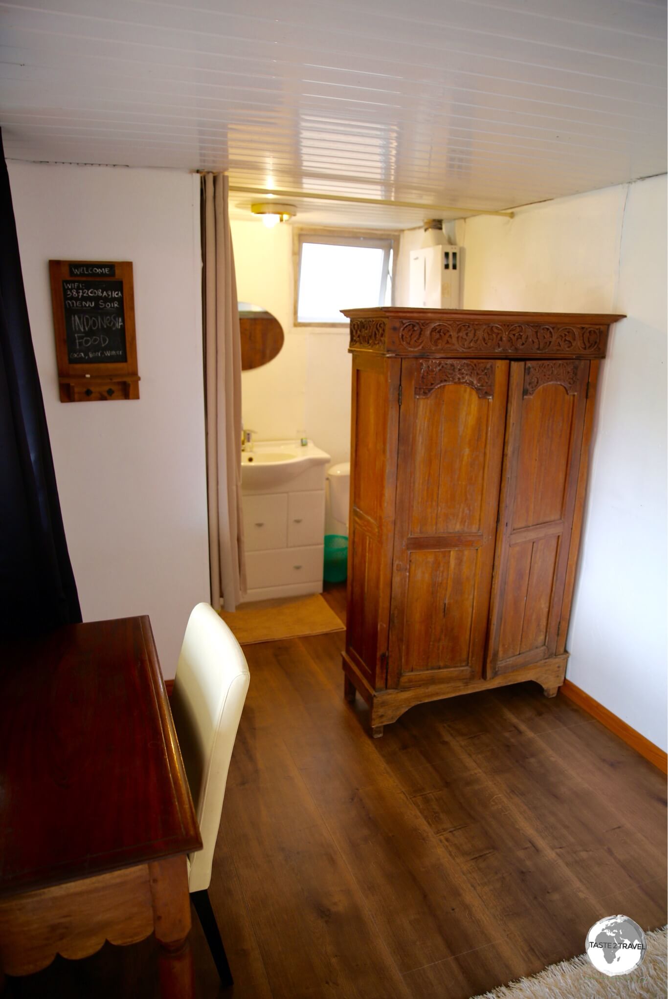 Interior of my shipping container room in La Foa, complete with Indonesian furniture.