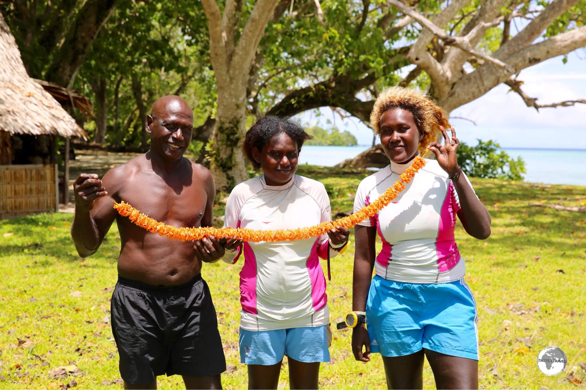 The Dive Munda team (l-r), Sunga, Jeno and Euna made a beautiful flowery lei during our surface interval.