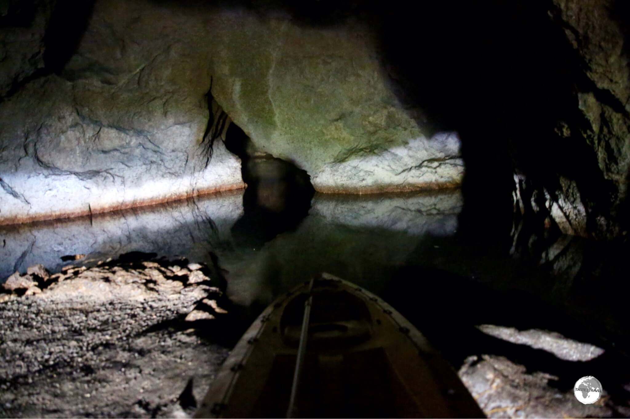 The kayak, seen here in the immediate foreground, can be used to explore the small underground lake inside Siviri Cave.