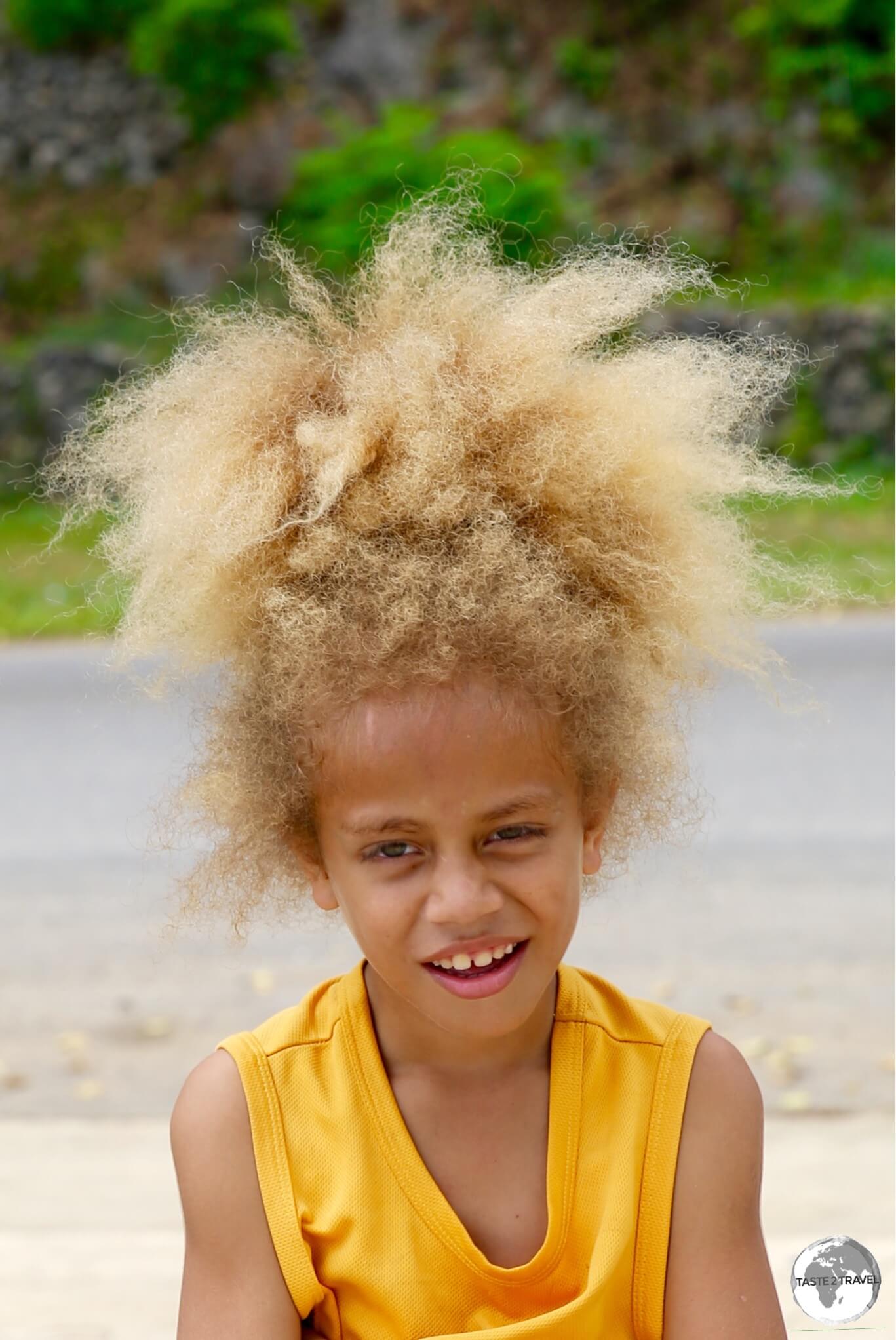 A cool dude with a shock of blond hair in Port Vila.