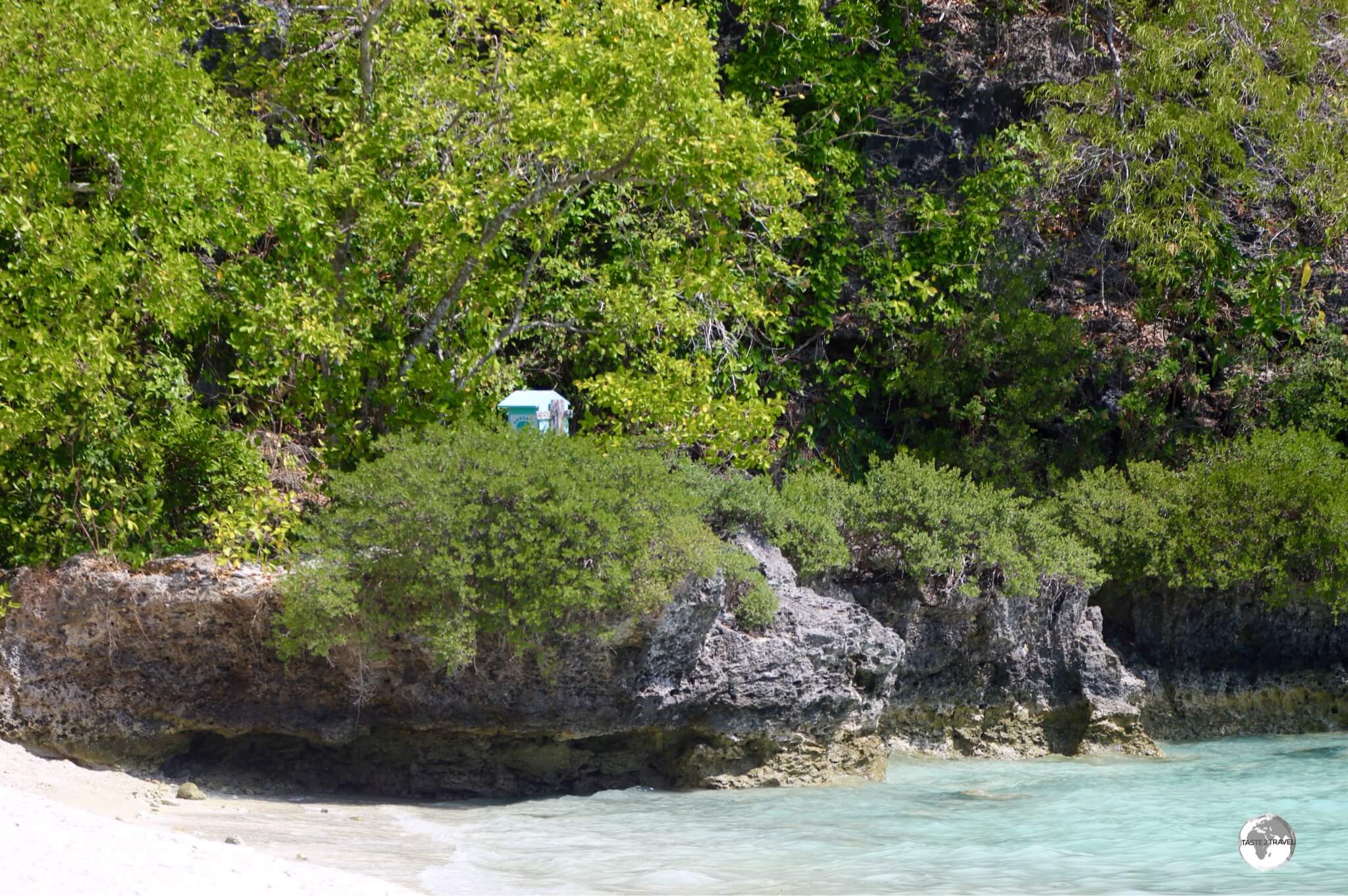 Can you spot the hidden post box? A lonely post box installed on an isolated beach on Lelepa Island.