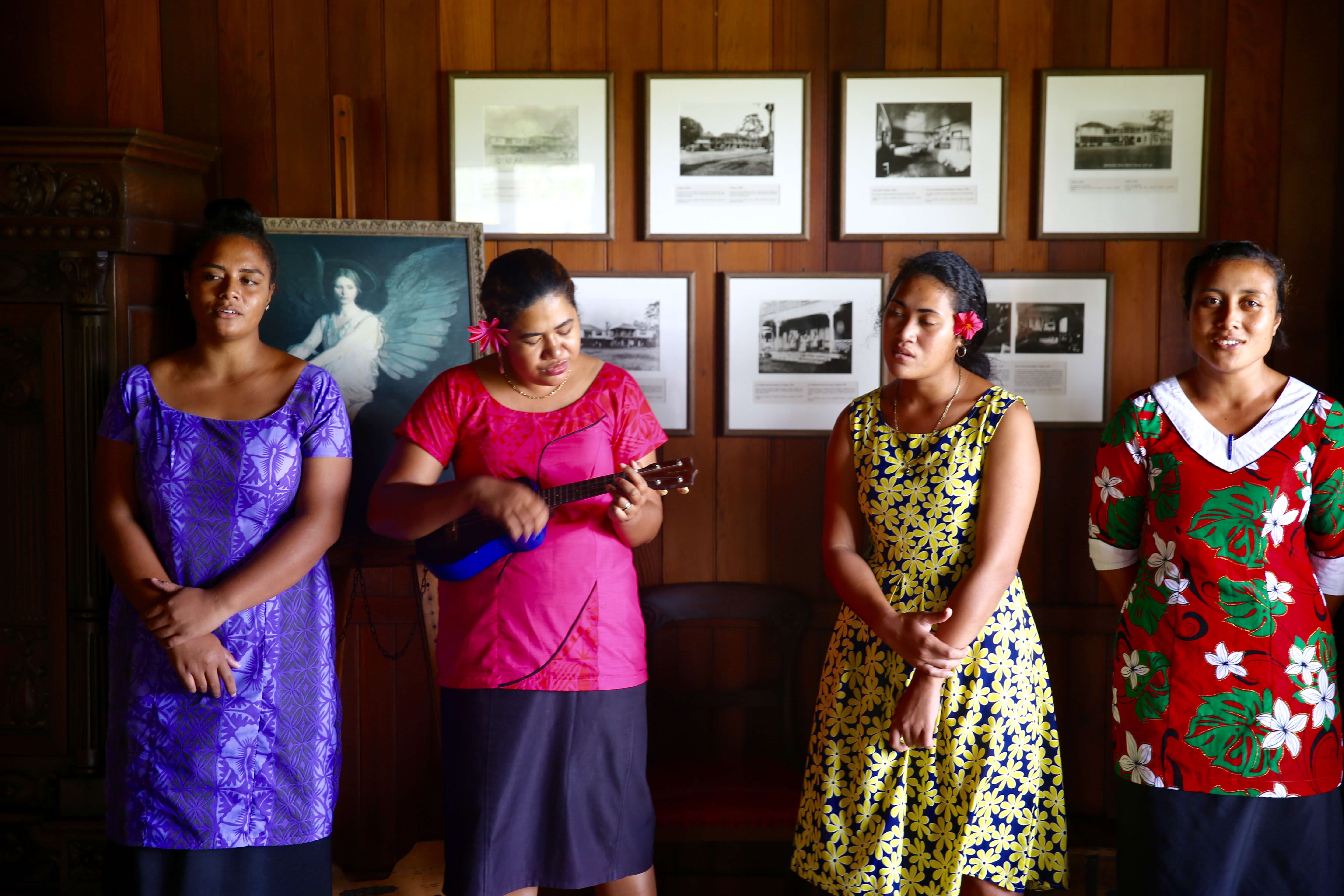 Staff at Villa Vailima singing poetry written by Robert Louis Stevenson.