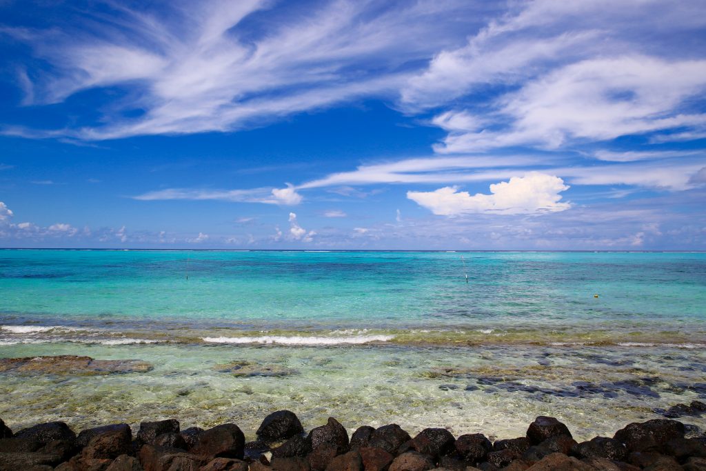 A typical east coast view on Savai’i with lava stones in the foreground.