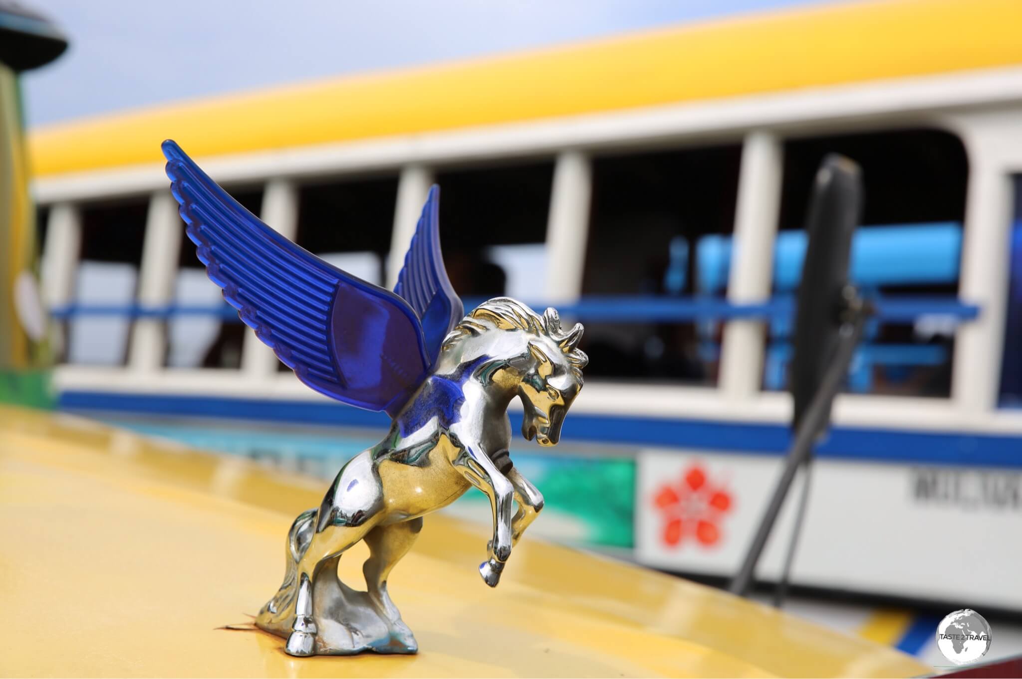 A shiny hood ornament on a Samoan bus. 