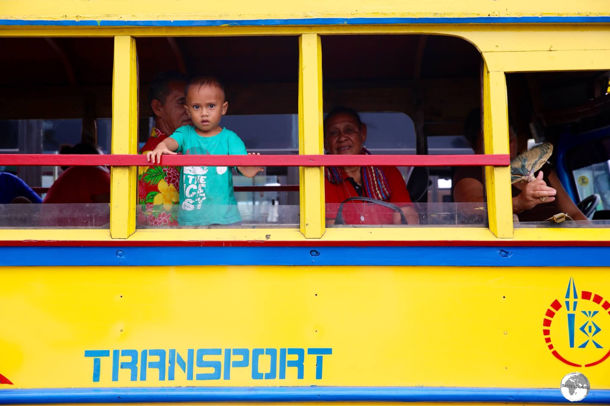 A Samoan boy, waiting for his bus to depart from Apia.