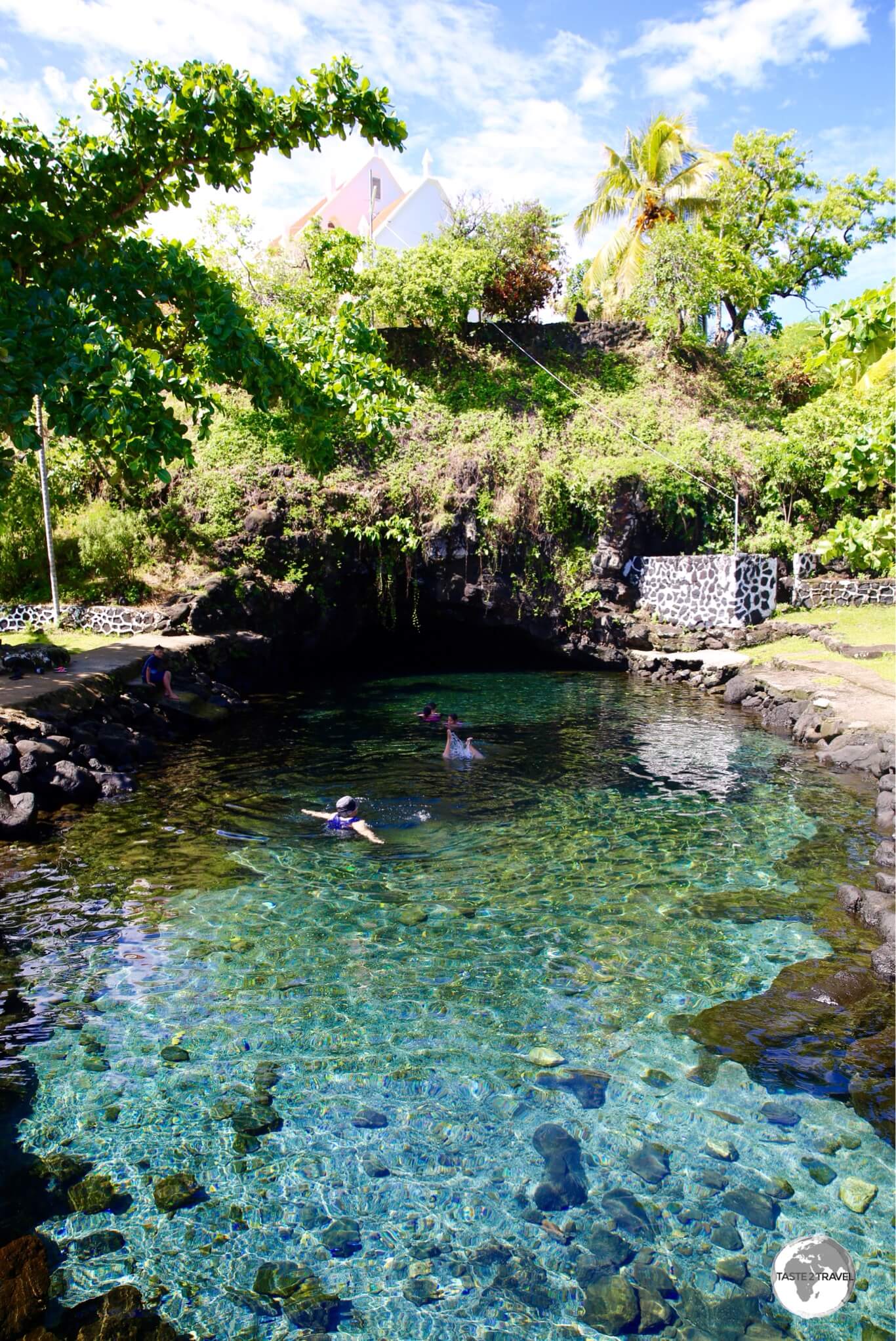 The pristine, crystal-clear spring water of the Piula cave pool.