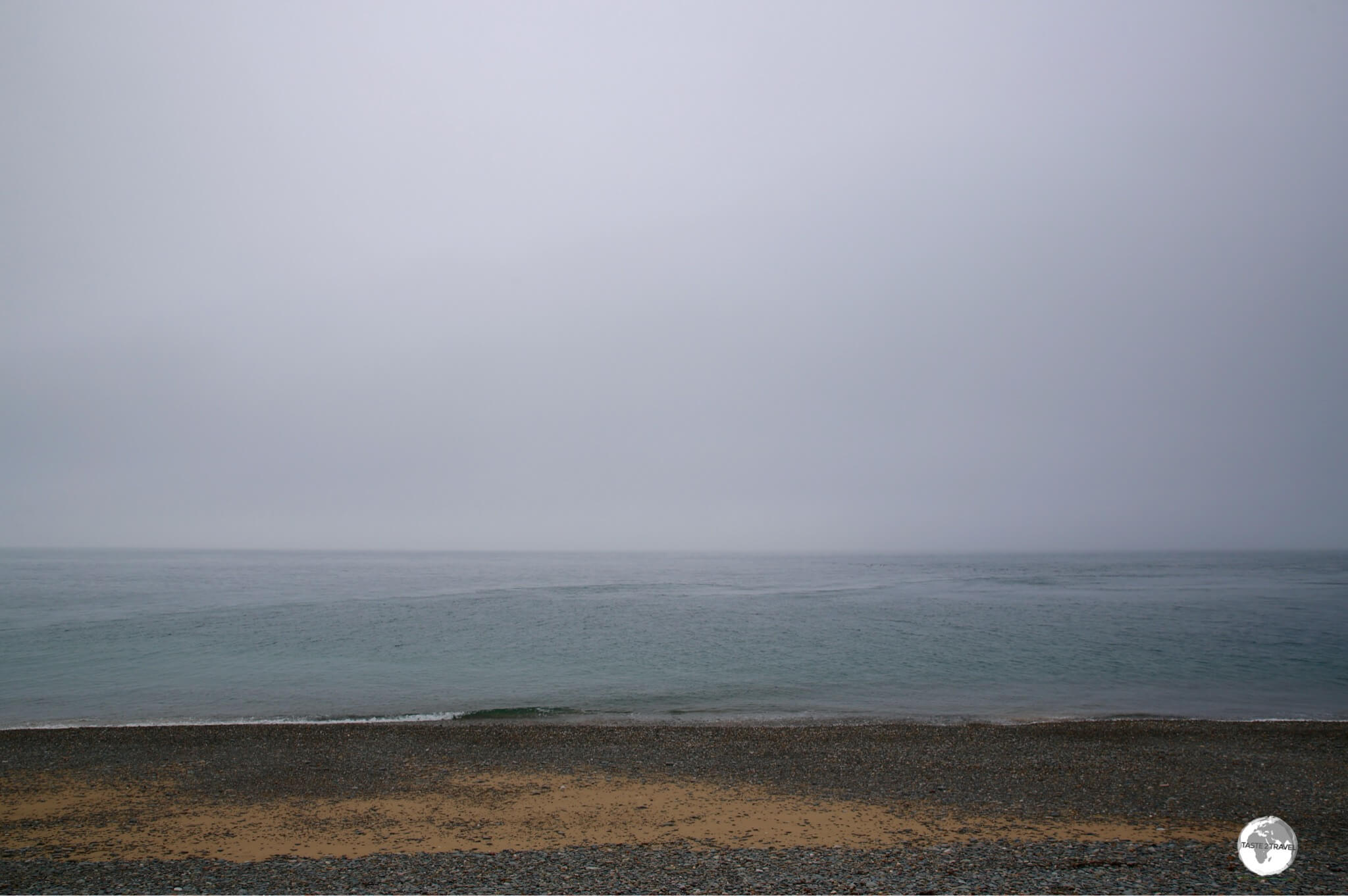 The pebbly beach at the Point of Ayre. Scotland lies just beyond the horizon.