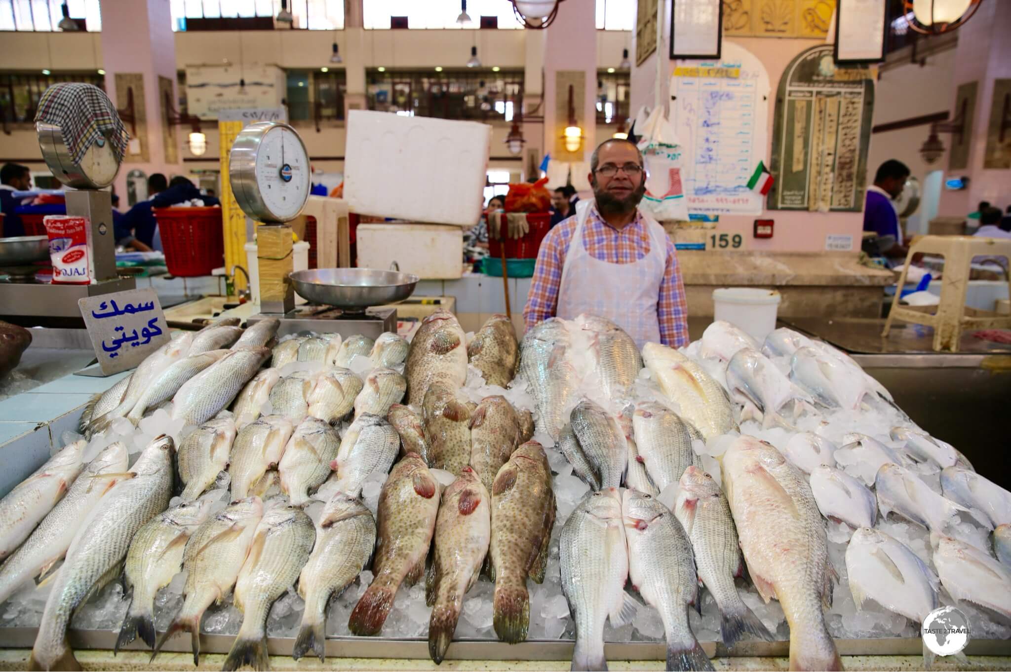 A fish monger with his produce at the Kuwait Central Fish market.