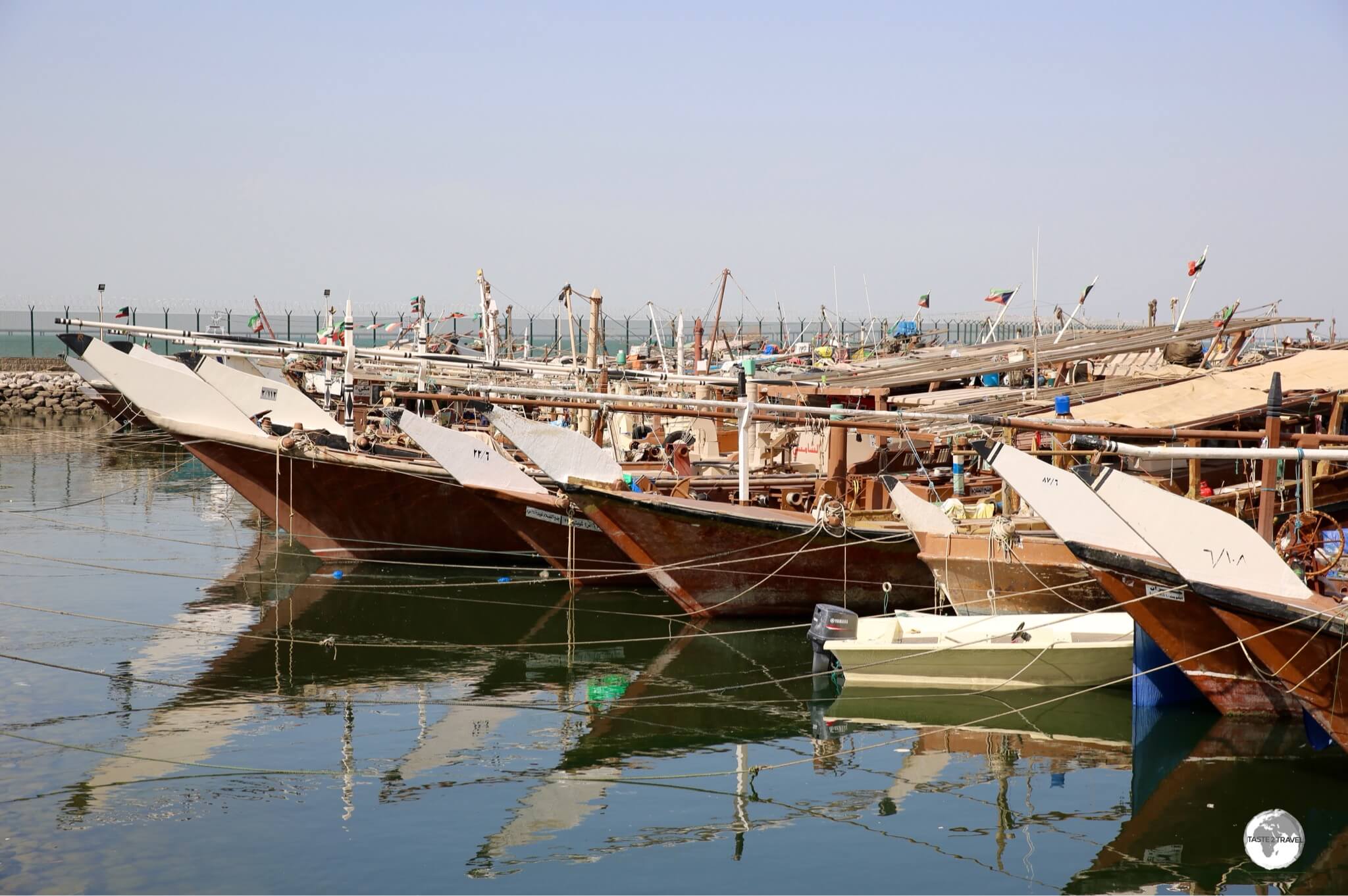 Traditional Dhow fishing boats line the Dhow harbour in downtown Kuwait.