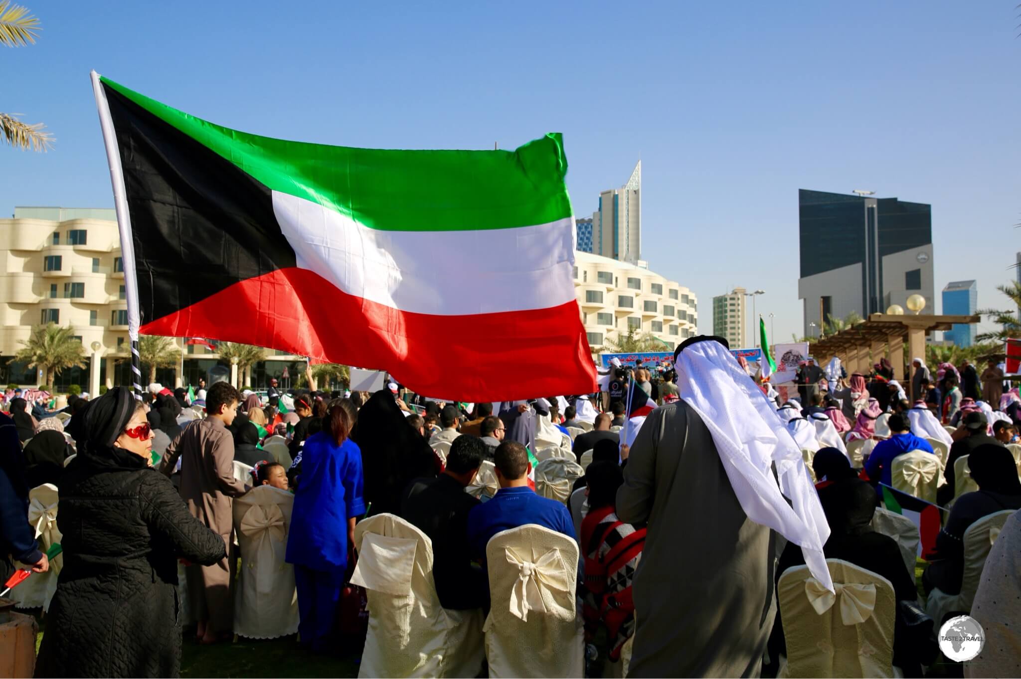 The Kuwaiti flag is flown everywhere throughout the country, including at this friendly political rally in Kuwait city.