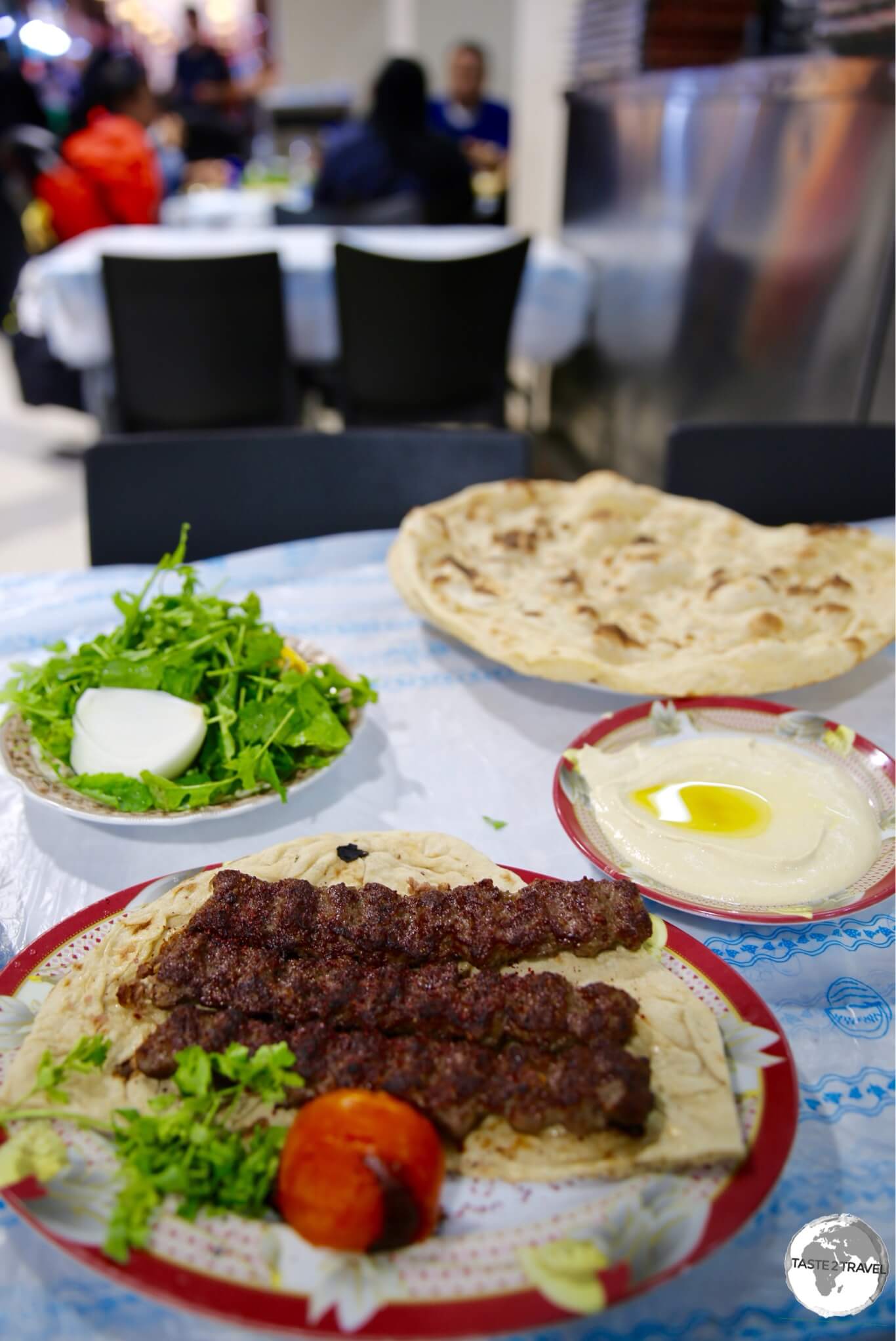 A perfect meal of spicy Kofte, creamy Humus and crispy flatbread, fresh from the Tandoor oven at Souk Al-Mubarakiya.