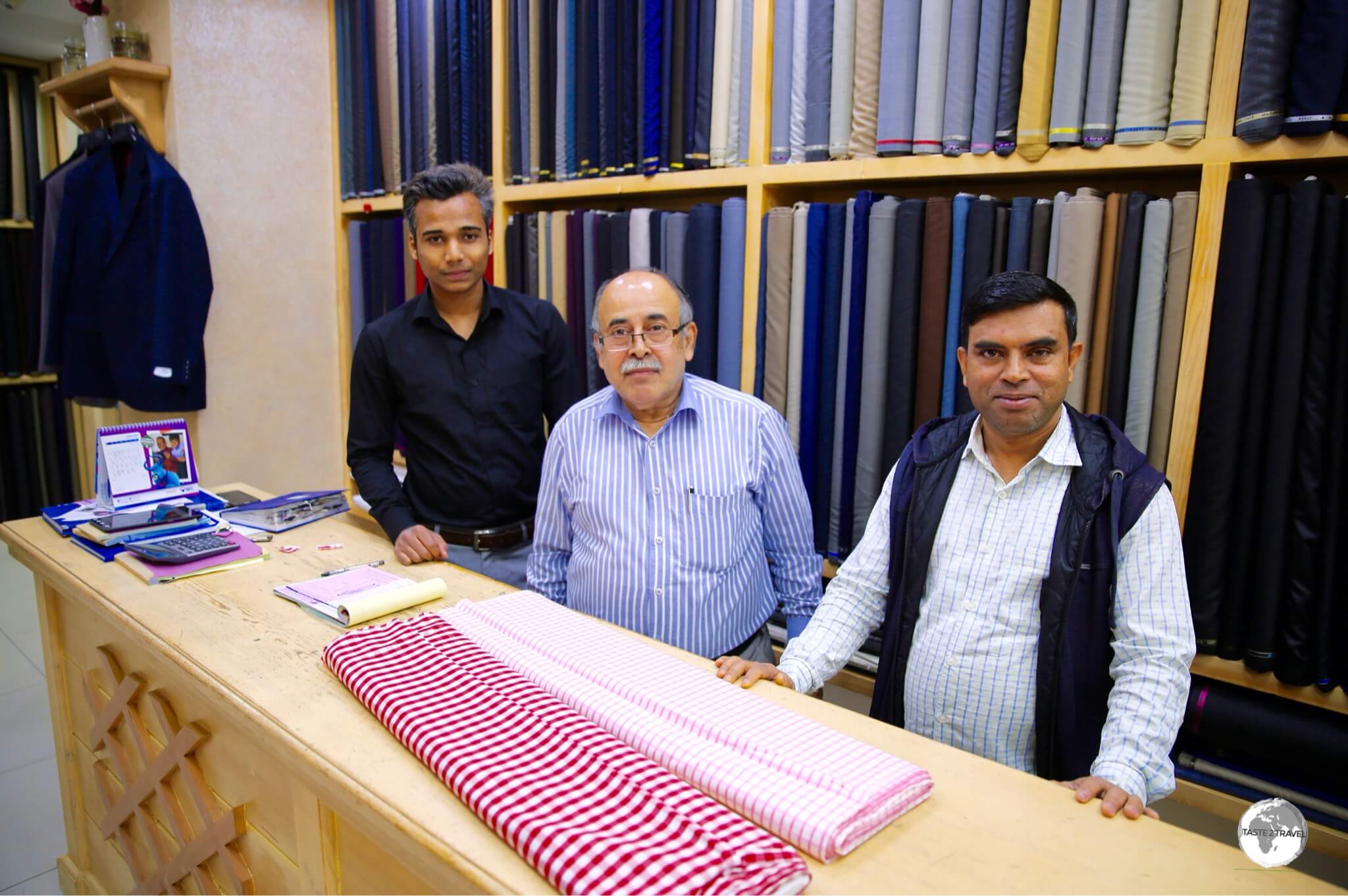 The friendly team of Indian tailors from 'Washington Tailors' in Manama Souk.