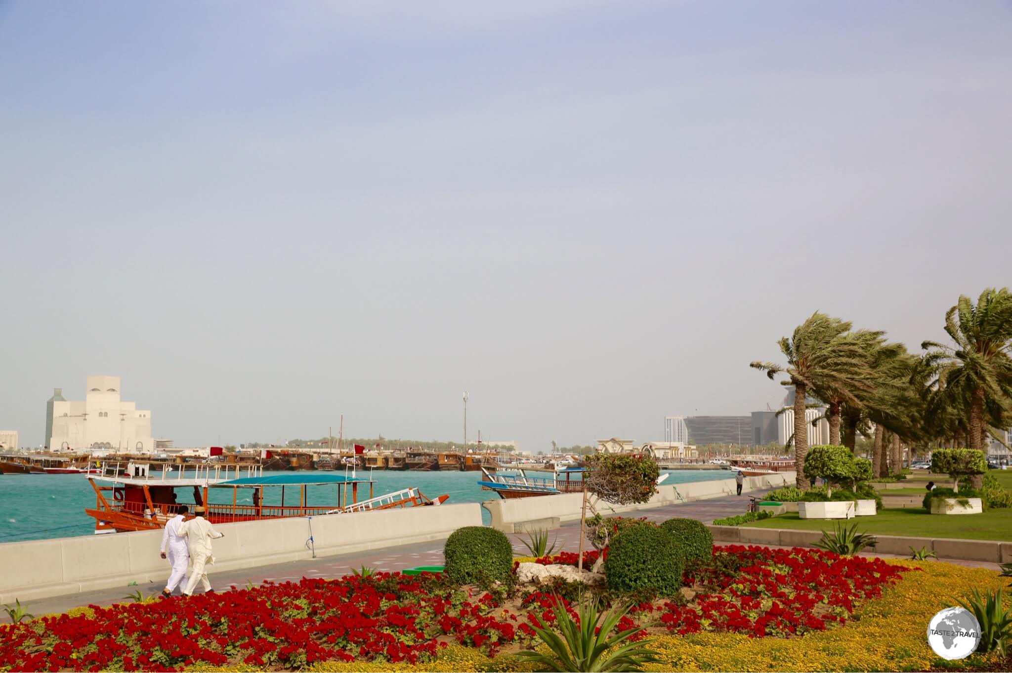 The 7-km long Doha Corniche is lined with flower beds, palm trees and planted grass.