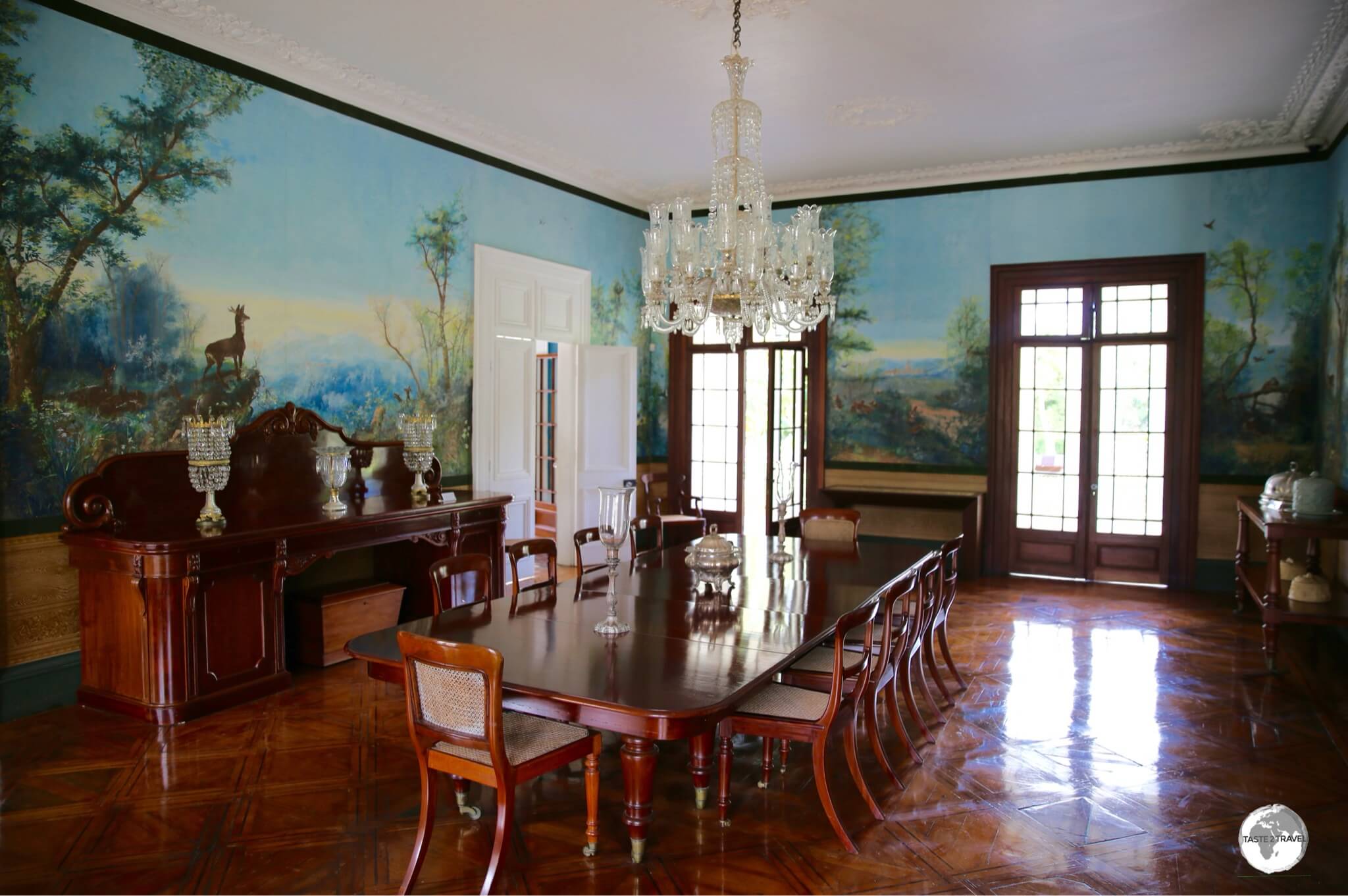 The dining hall at Château de Labourdonnais is lined with hand-painted wallpaper.