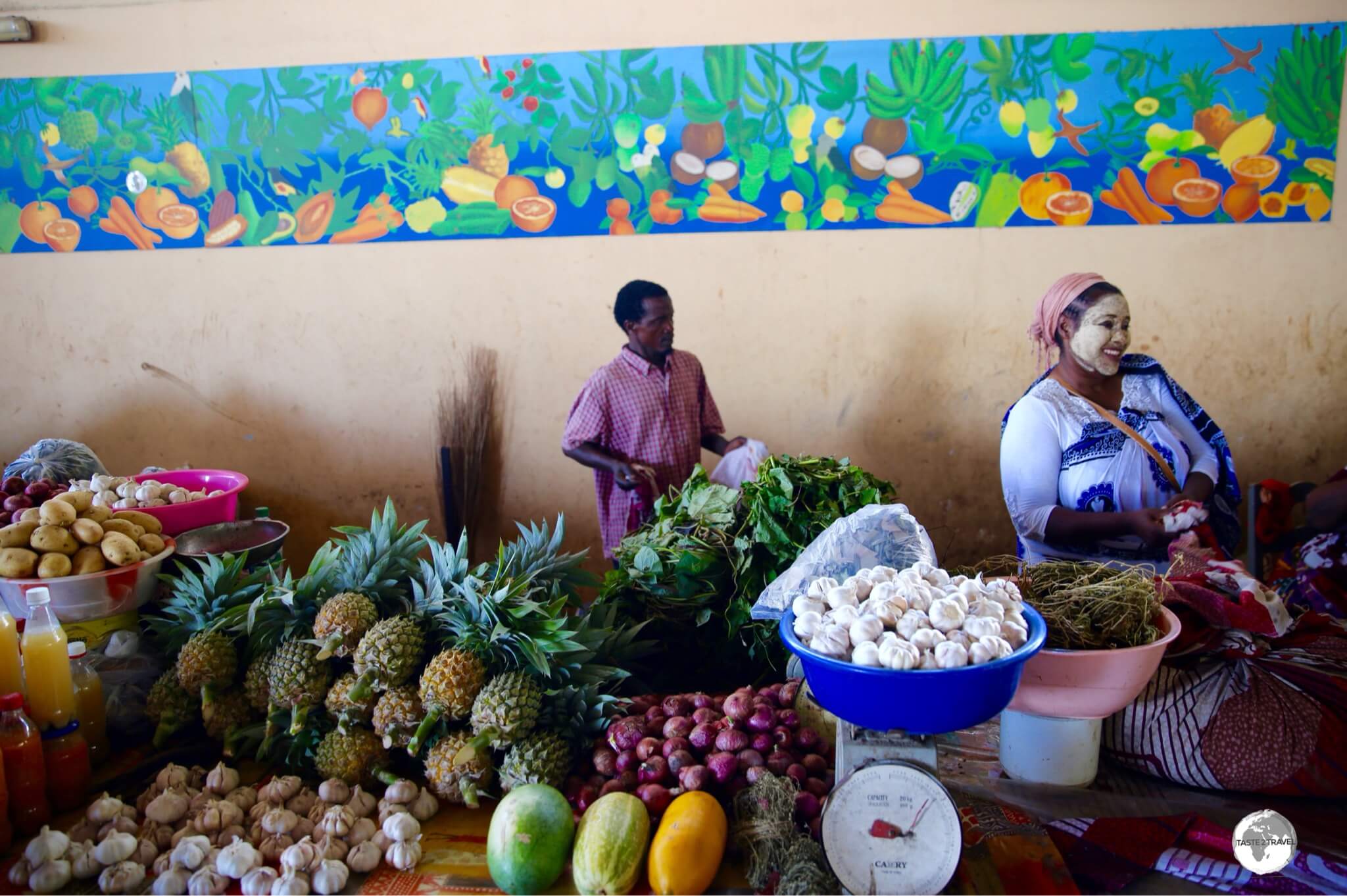 A Mahorais store owner at Mamoudzou Central market wearing the traditional 'salouva'. 