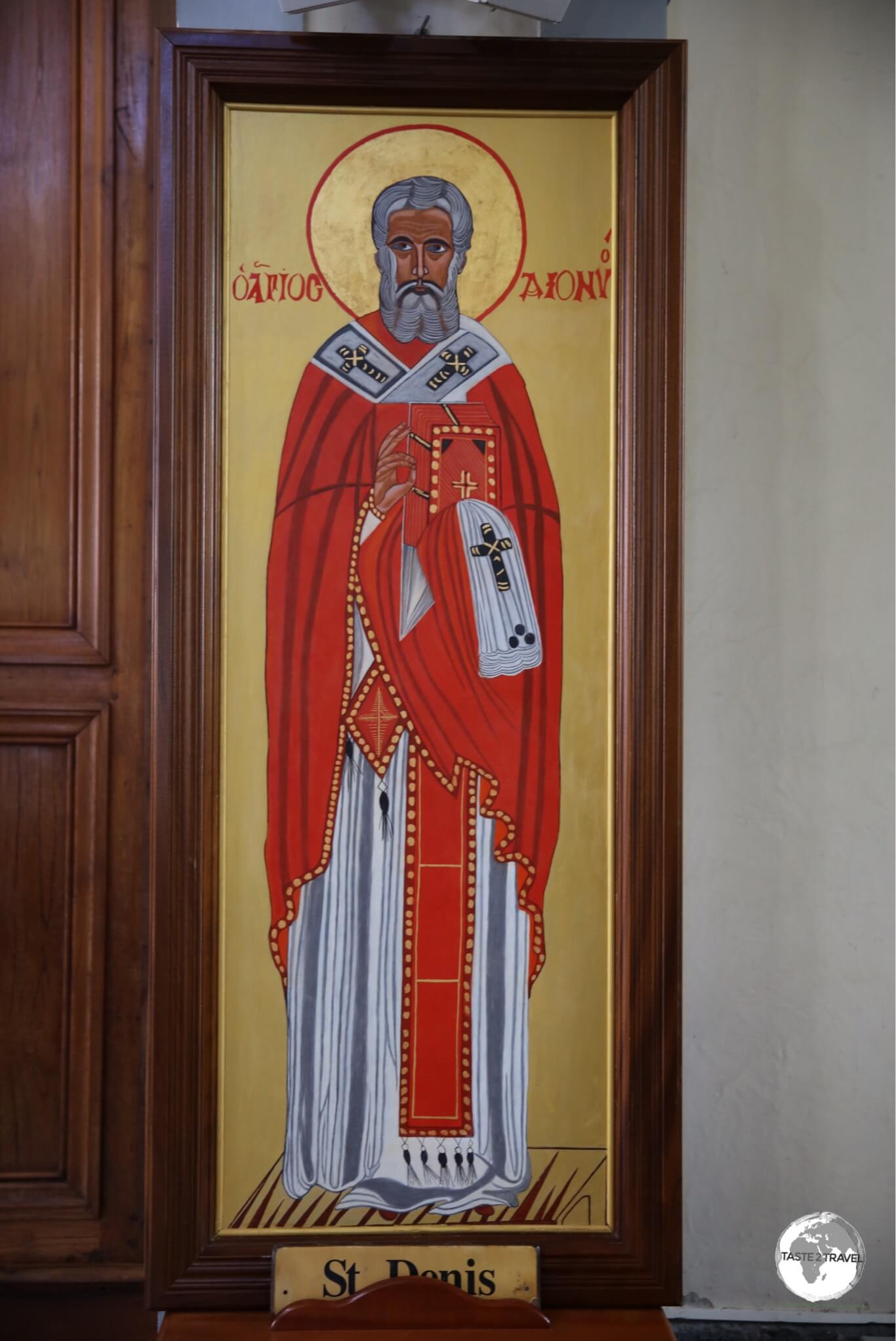 An image of the patron saint of the city, Saint Denis, on display inside the Cathedral of Saint Denis.