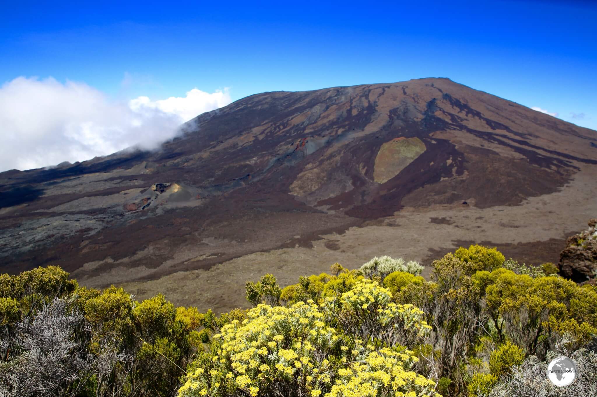 A beautiful view to the summit of the Piton de la Fournaise from the hiking trail. 