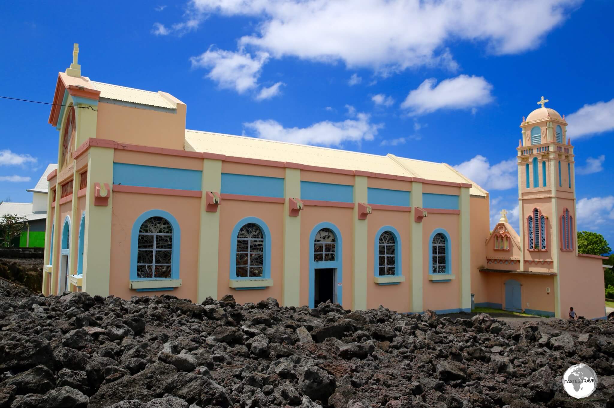 A side view of the <i>Église Notre Dame des Laves</i> better illustrates its position in the lava field.