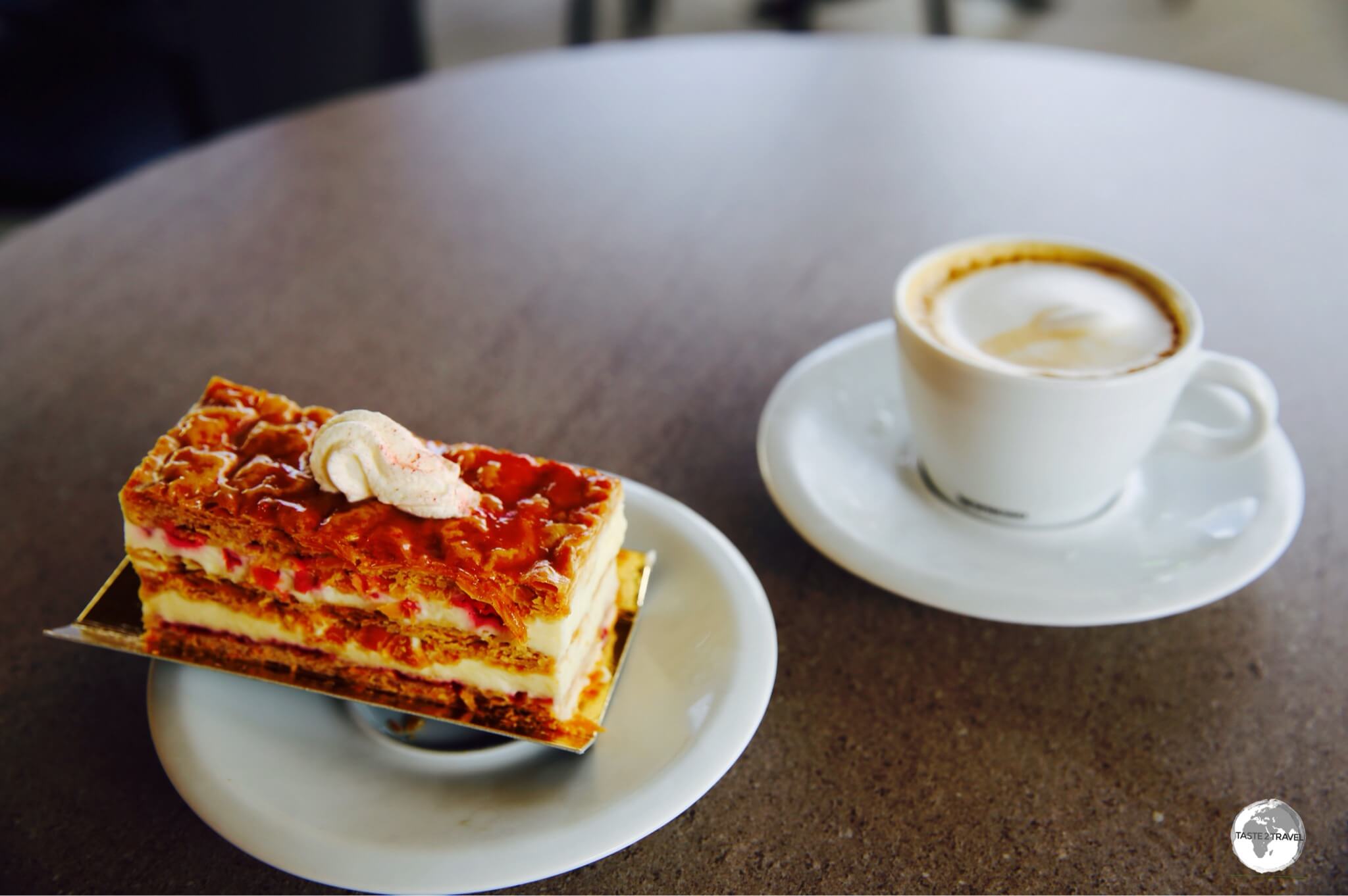 A freshly made raspberry <i>mille-feuille</i> with an espresso macchiato at <i>La Case à Pains</i> in St. André. <i>Parfait!</i>