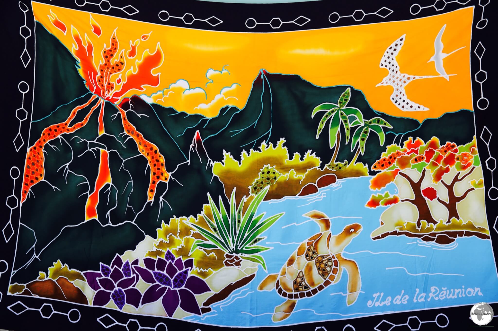 A hand-painted Reunion sarong features a fiery Piton de la Fournaise. 