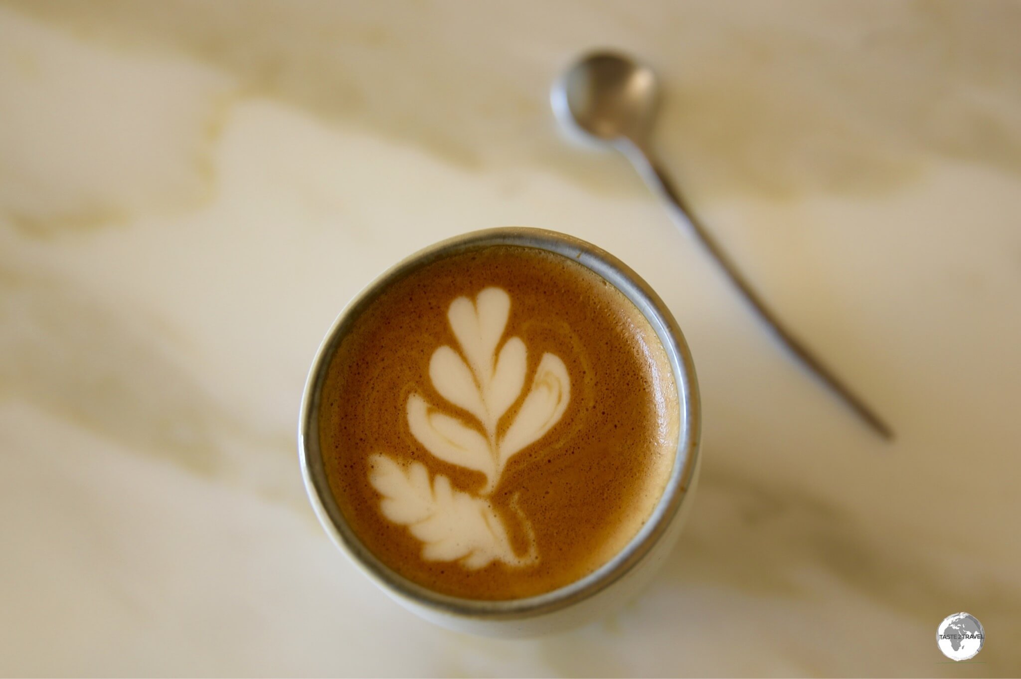 Great coffee served with hand-forged cutlery at the Desert Rose Cafe at the National Museum of Qatar, where a cafe latte costs 20 QR (US$5.50).