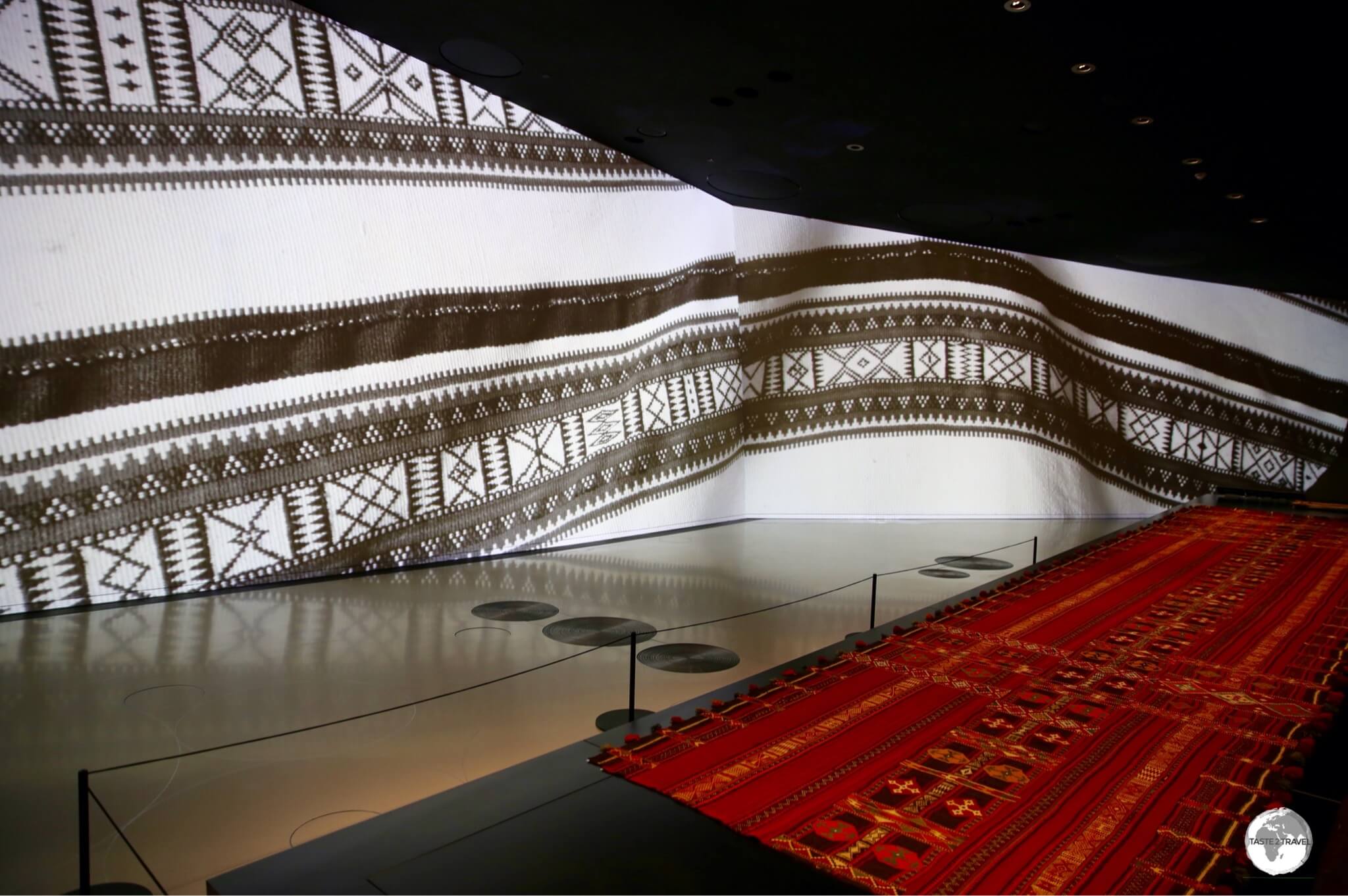 The large, curved walls of the National Museum of Qatar are used to project images which enhance the various displays.