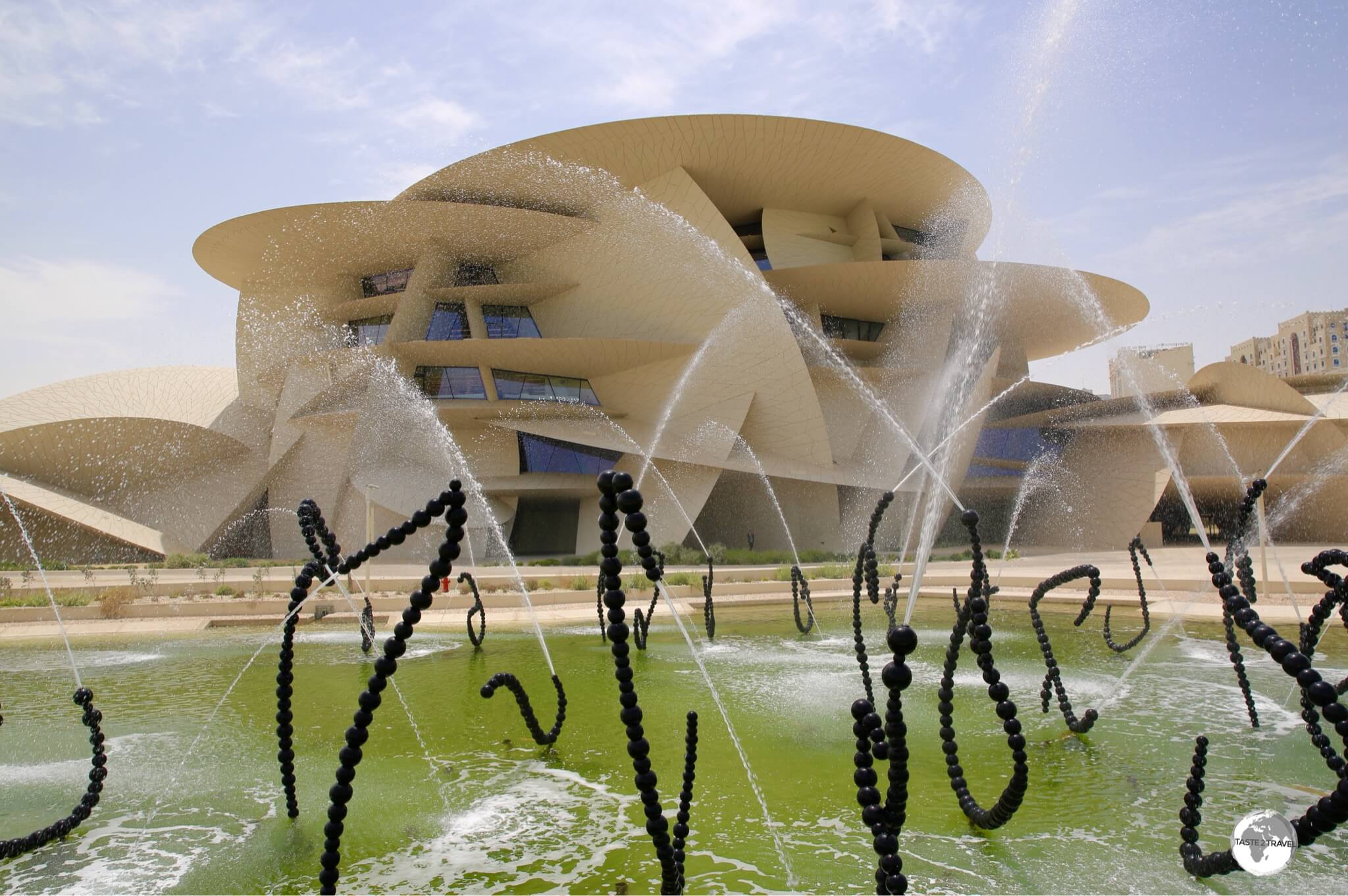 A view of the National Museum of Qatar and Jean-Michel Othoniel’s “ALFA”, a water feature which consists of 114 fountain sculptures. 