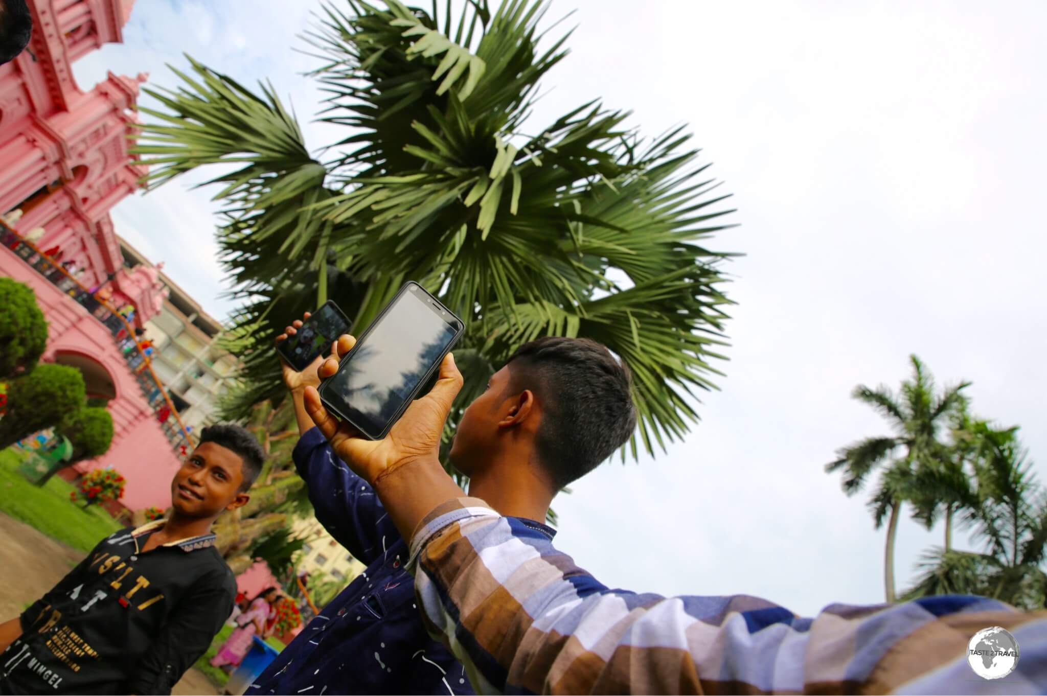 Taking a selfie of a selfie at the Pink Palace.