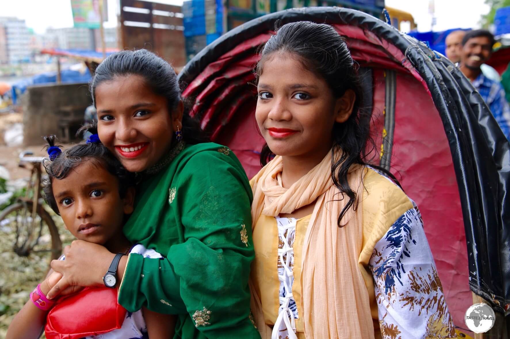 Girls squeezed onto a Bicycle Rickshaw in old Dhaka.