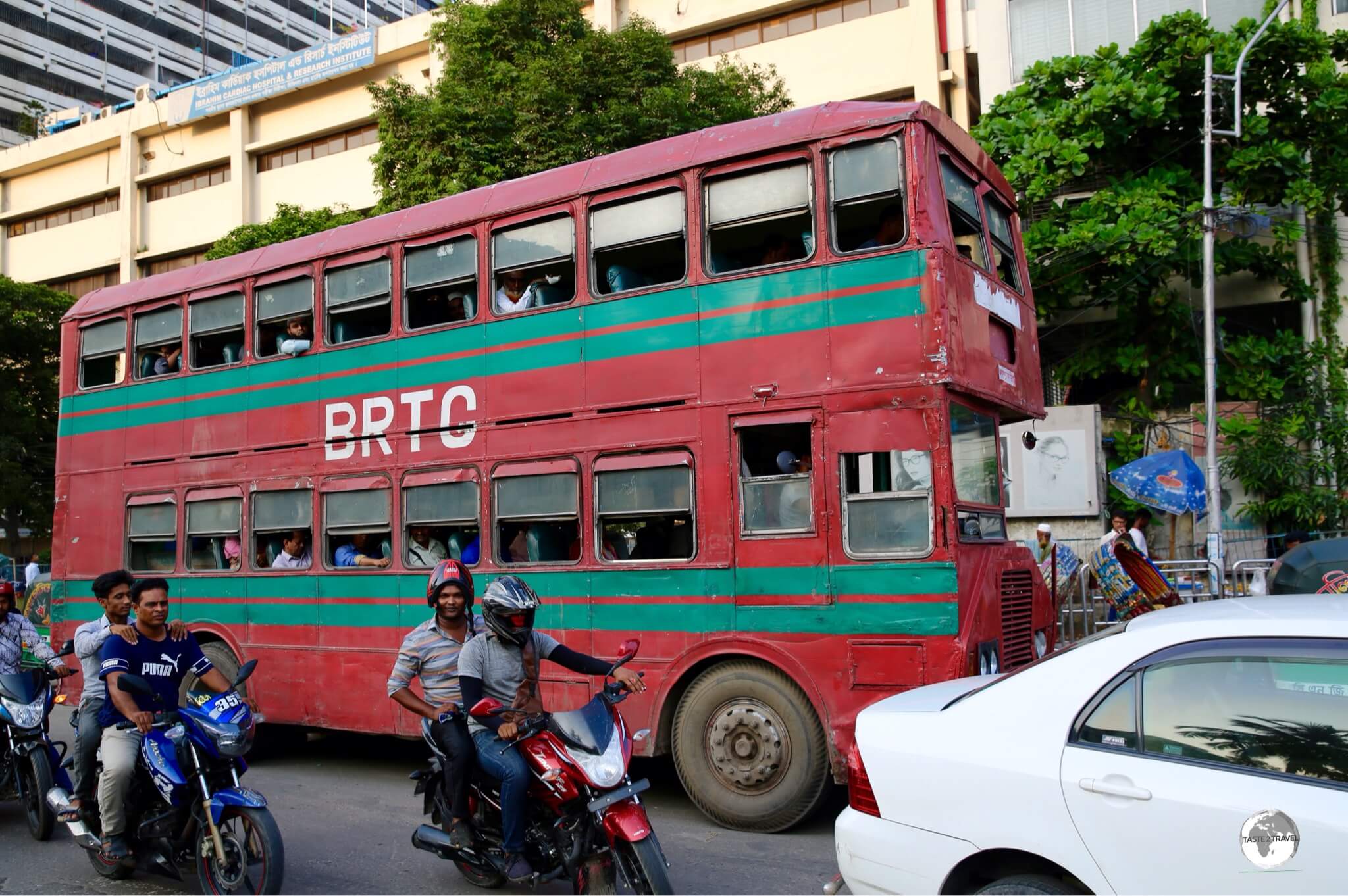 No - it's not London! Very old and beaten, red, double-decker buses ply the streets of Dhaka.