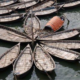 Docked wooden ferries at Sadarghat boat terminal.