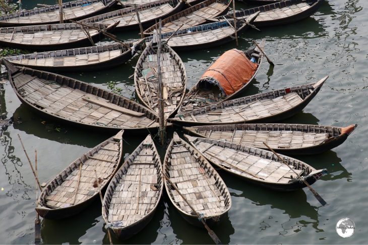 Docked wooden ferries at Sadarghat boat terminal.