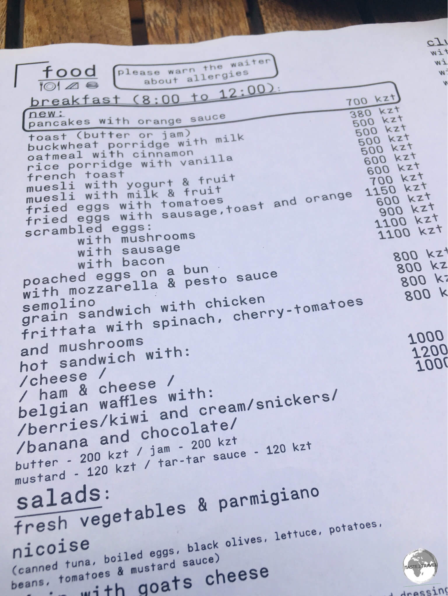 The breakfast menu at Nedelka Cafe in Almaty provides an example of typical restaurant prices. 