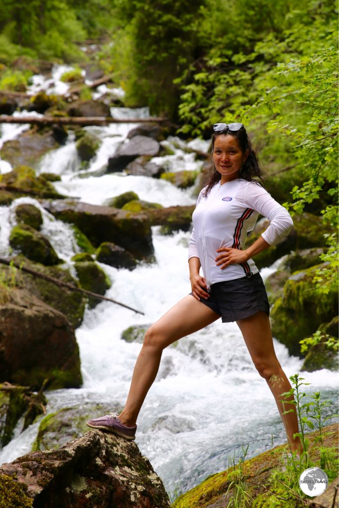 Another fellow tour passenger from Almaty, striking a pose in the spectacular Kolsai National Park.