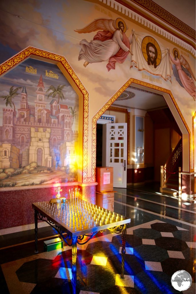 Sunlight illuminates artwork in the foyer of the cathedral.