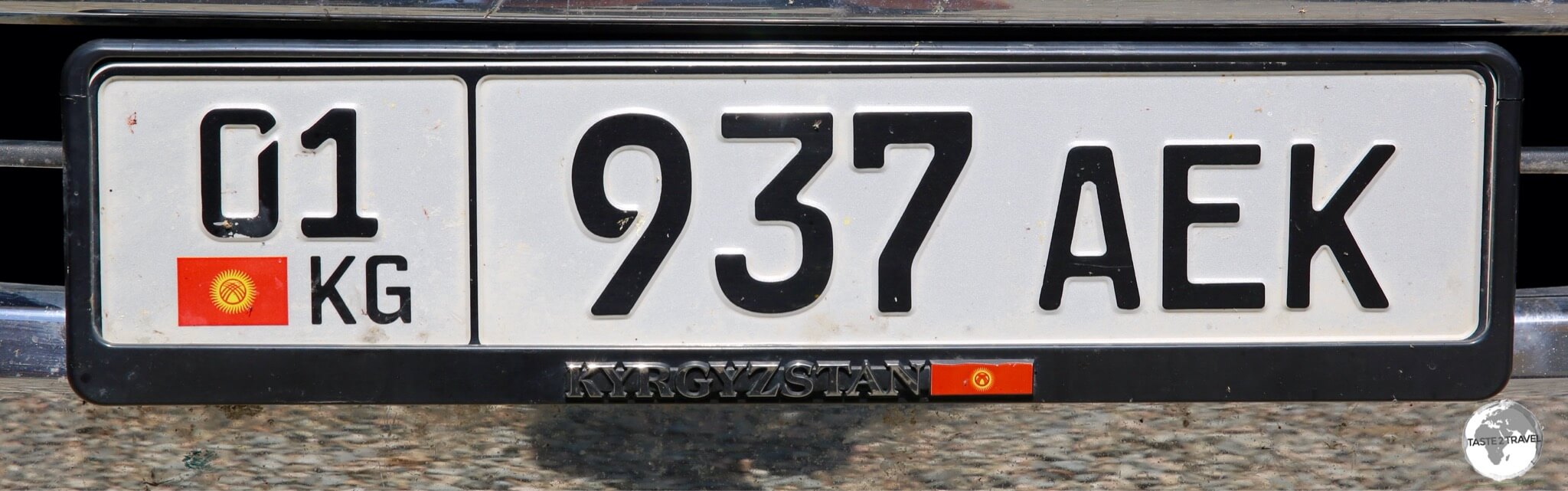 The Kyrgyzstan license plate on my rental car. 