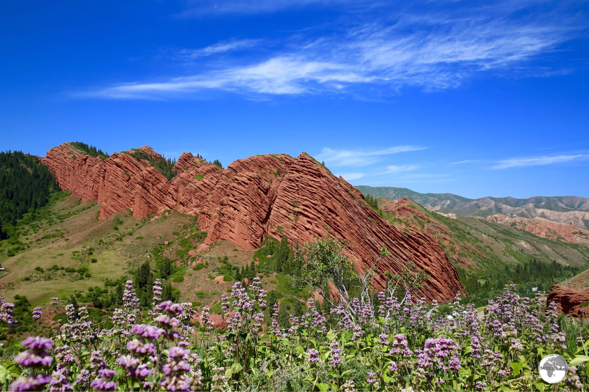 Jeti-Ögüz, which translates as <i>Seven bulls</i>, is a sandstone formation which rises from a lush green valley.