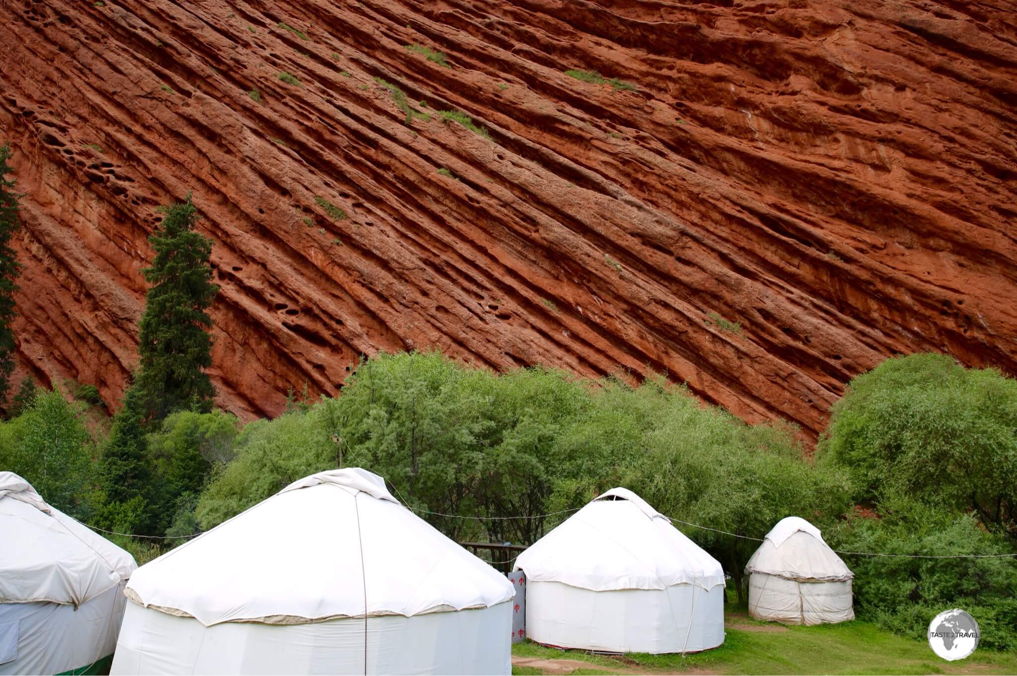 The ultimate wind barrier - a yurt camp, protected by the towering walls of Jeti-Ögüz.