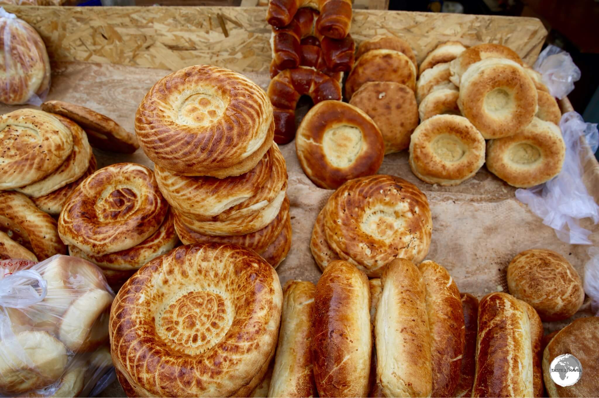 The bakeries of Karakol market are famous for their <i>Mai Tokoch</i>, a round Uighur-style bread which is baked in a clay tandoori oven.