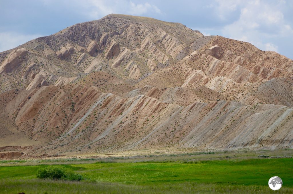 A colourful sandstone mountain outside the town of Kochkor.