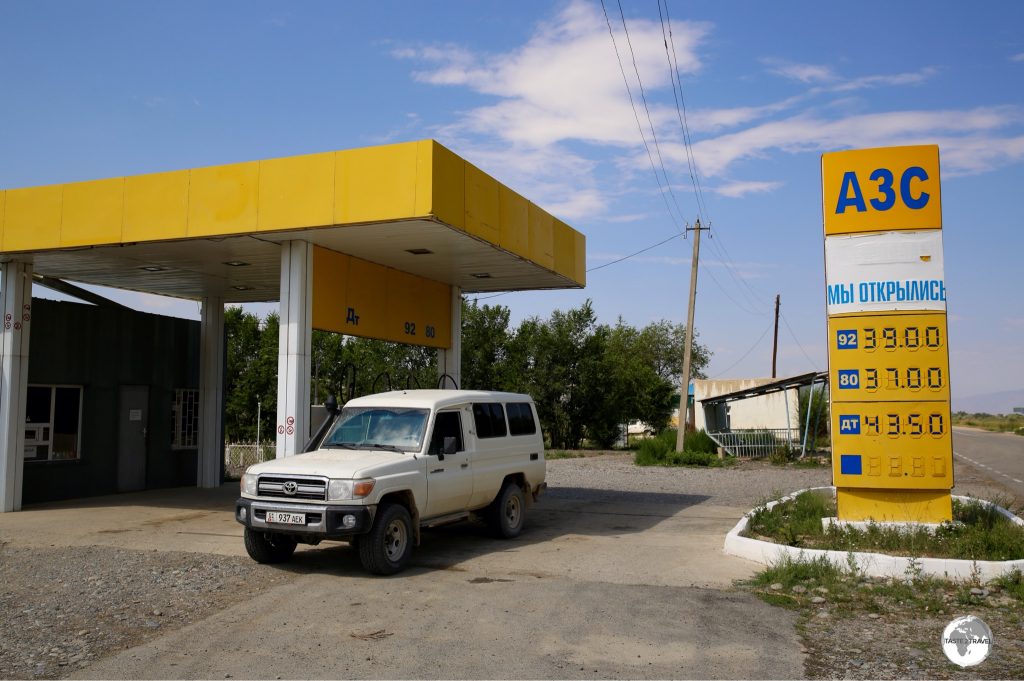 Filling up at a petrol station in the remote town of Ak-Tal, the first and only station in hundreds of miles.