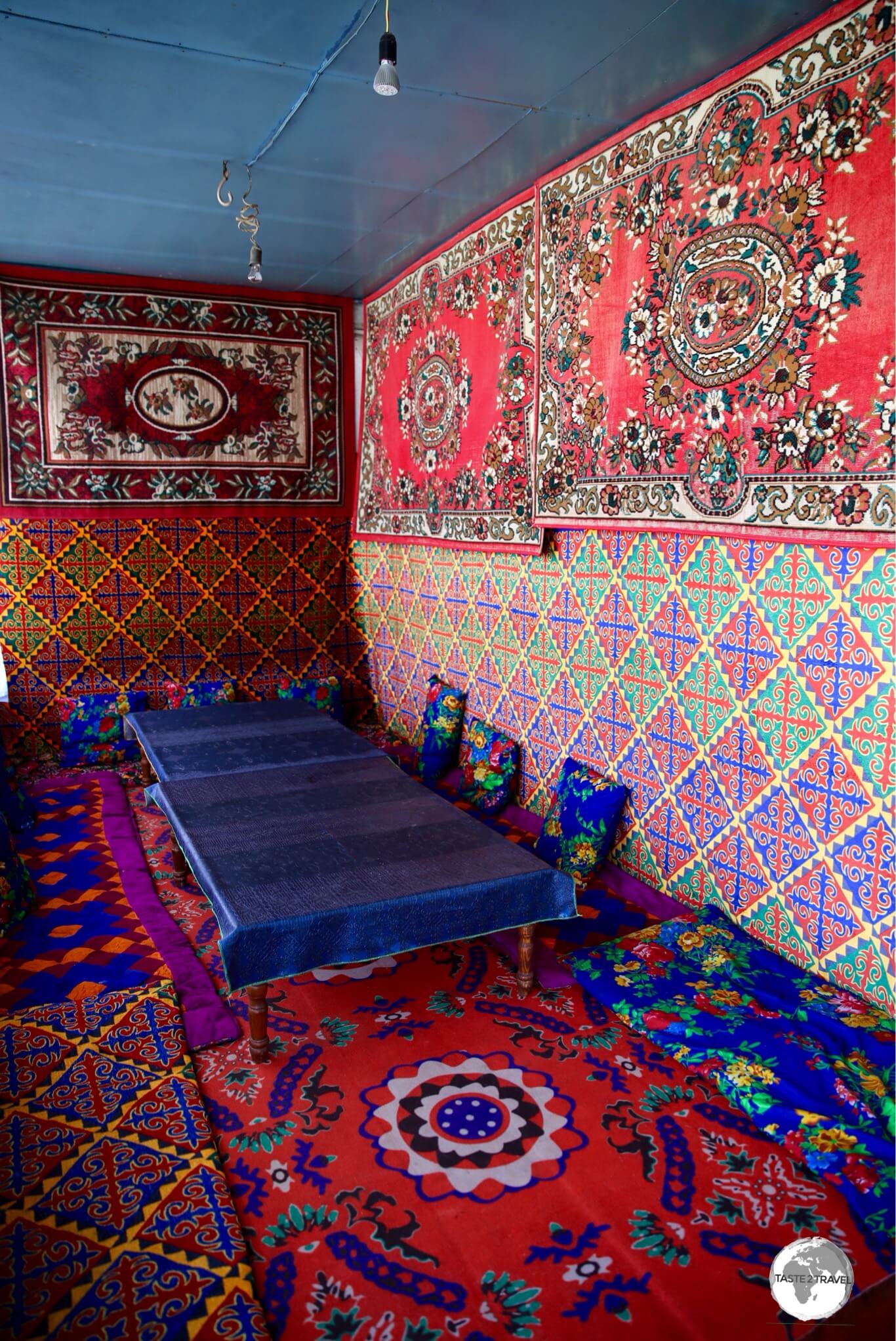 The colourful communal dining area at Homestay Aigerim.