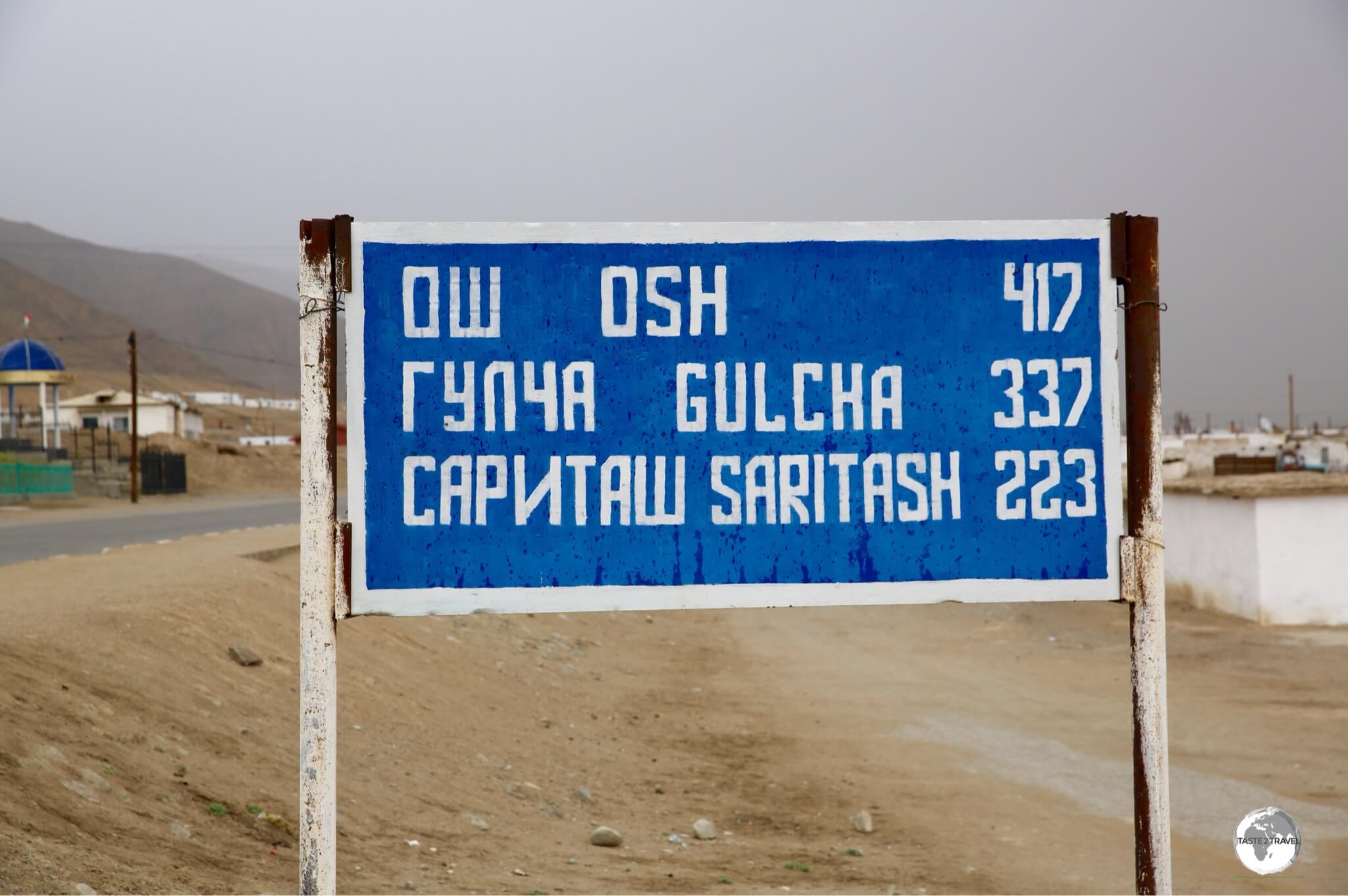 A road sign in Murgab indicates distances to towns which lie north along the Pamir Highway.